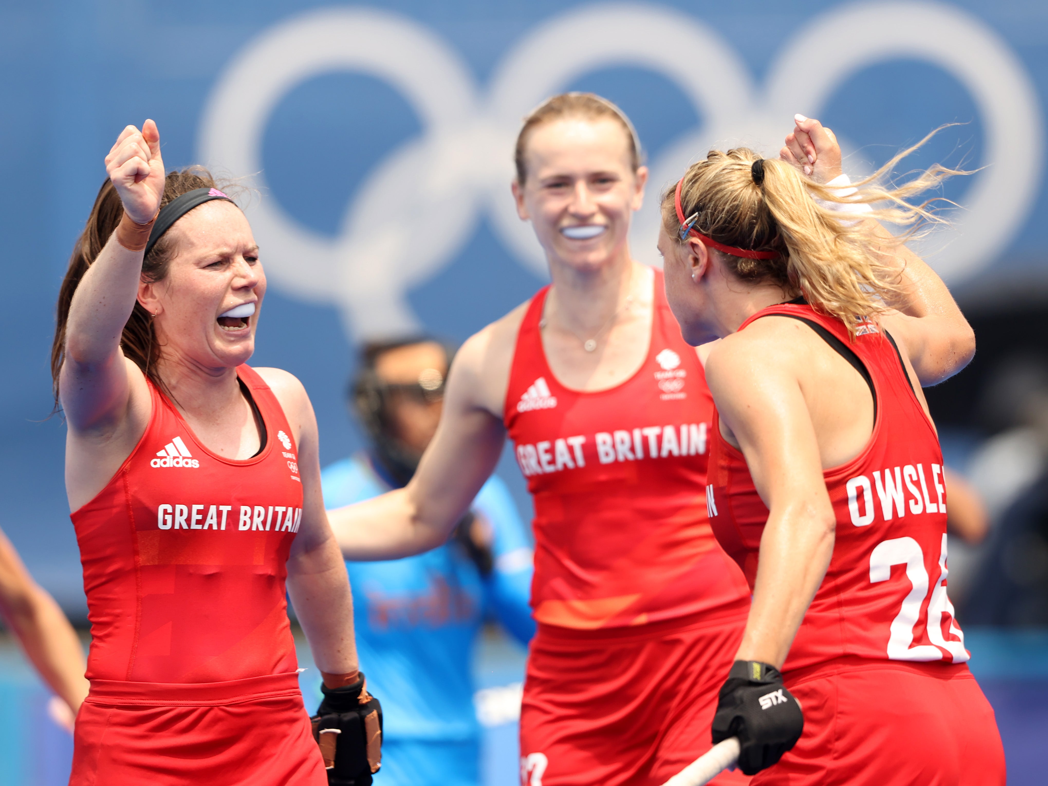 Lily Owsley of Team Great Britain celebrates scoring the third goal with Laura Unsworth during the Women's Preliminary Pool A match between Great Britain and India on day five of the Tokyo 2020 Olympic Games