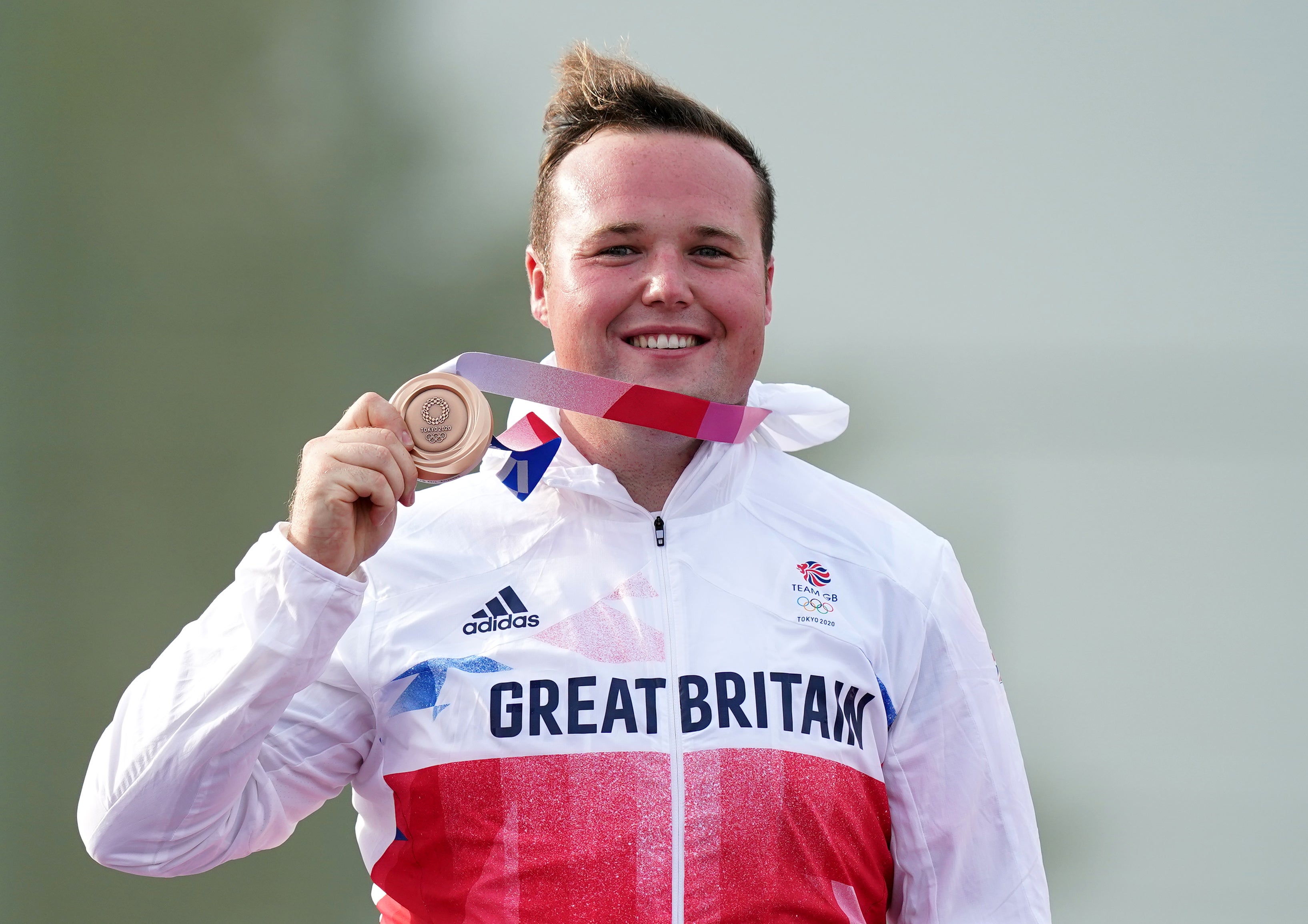 Coward-Holley celebrates with his bronze medal