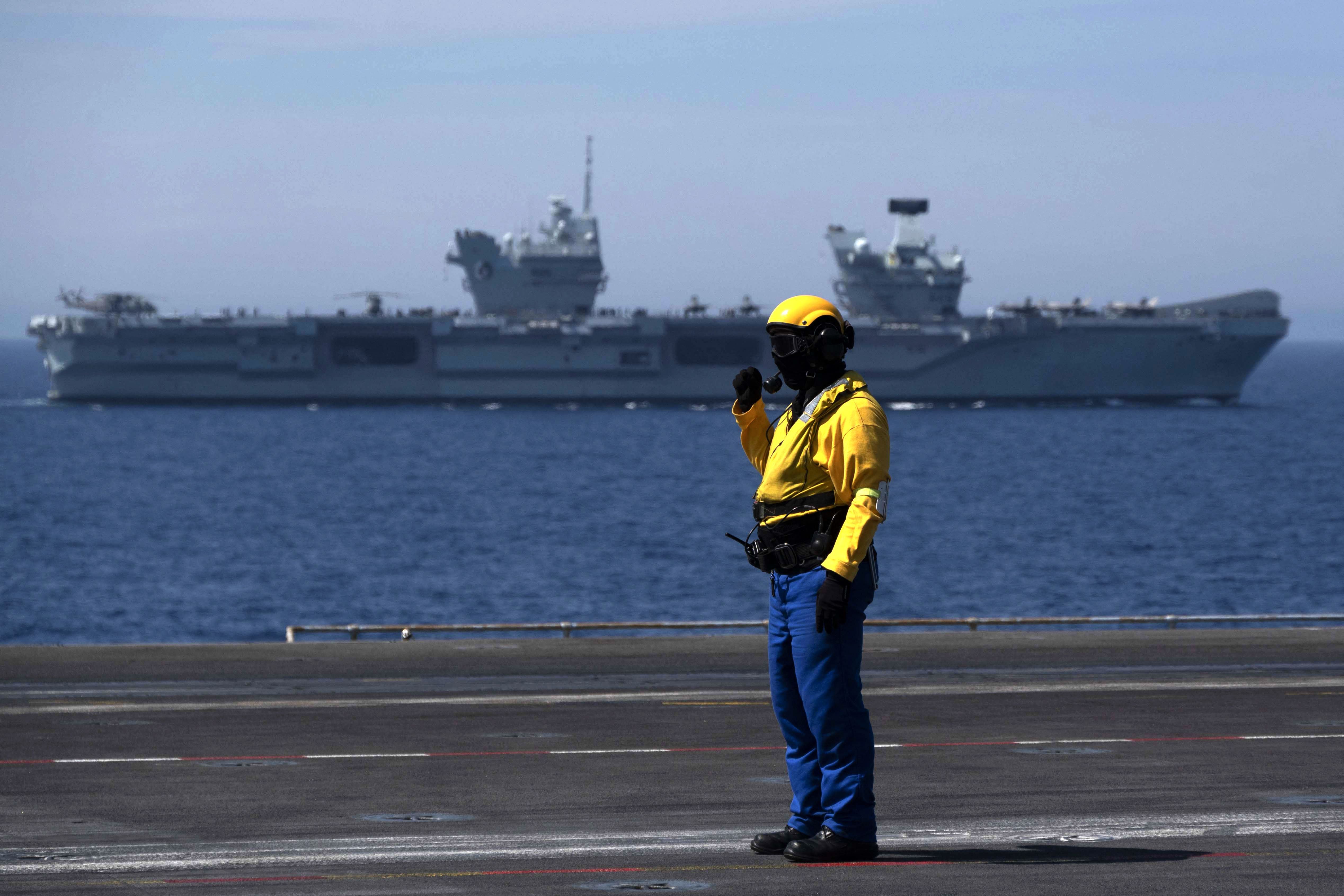 The Royal Navy’s aircraft carrier HMS Queen Elizabeth in the background during the Navy exercise ‘Gallic strike’ off the coast of Toulon in June, 2021