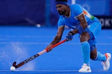 Why are hockey pitches watered at the Tokyo Olympics?