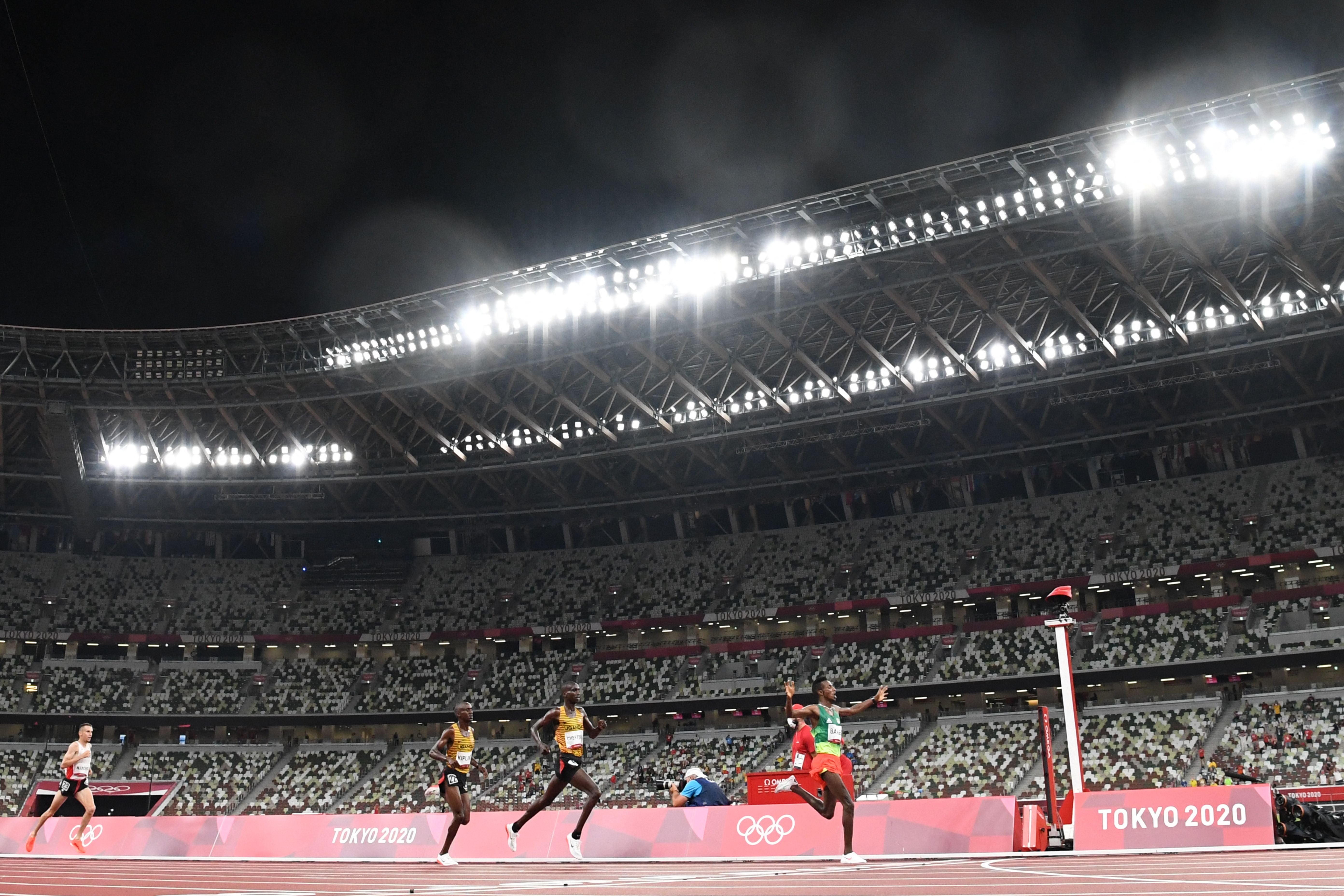 Ethiopia’s Selemon Barega celebrate as he crosses the finish line in the 10,000m