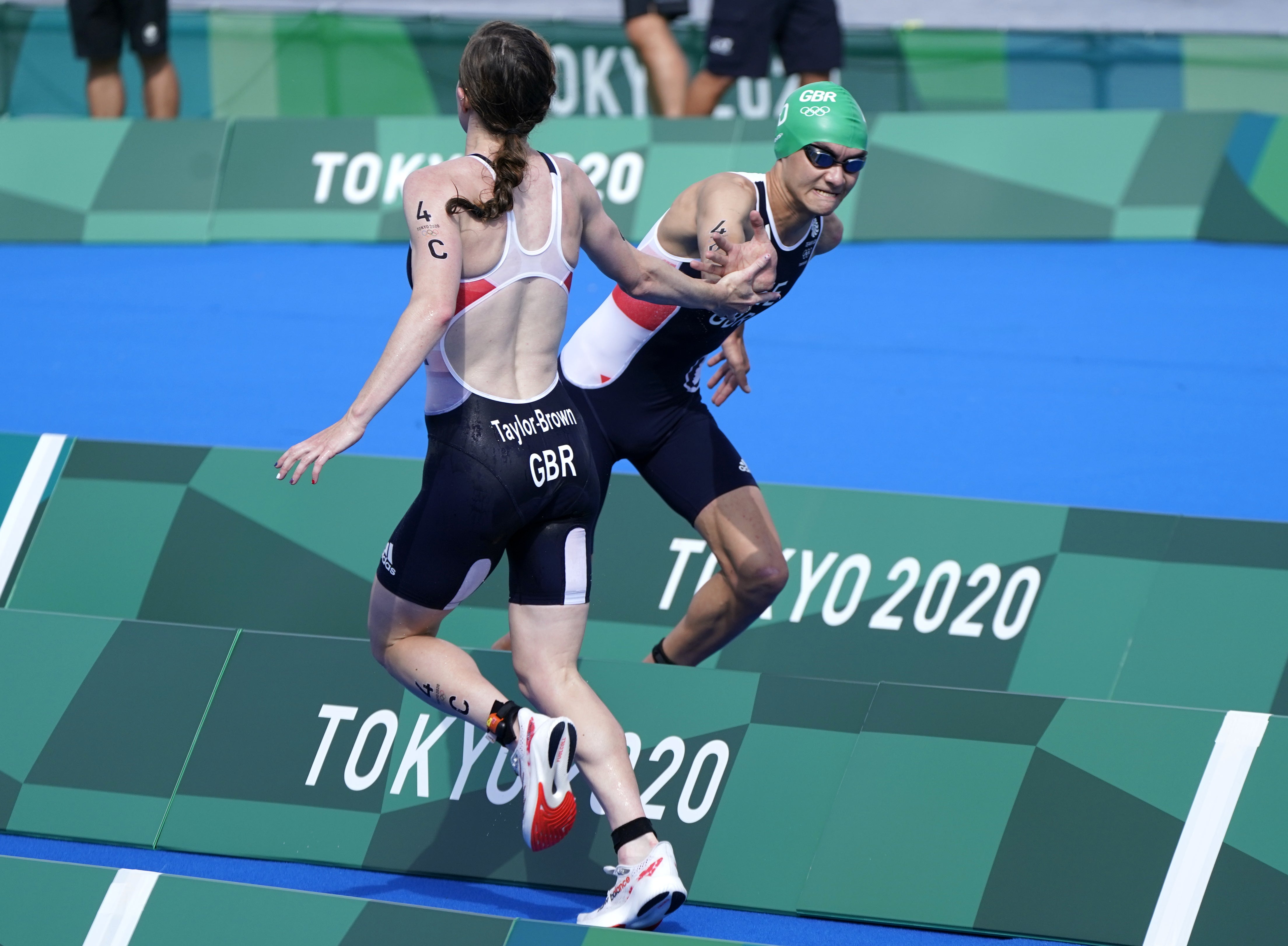 Georgia Taylor-Brown hands over to team-mate Alex Yee in Tokyo 2020. The triathletes are both favourites at this year’s games in Birmingham (Danny Lawson/PA)