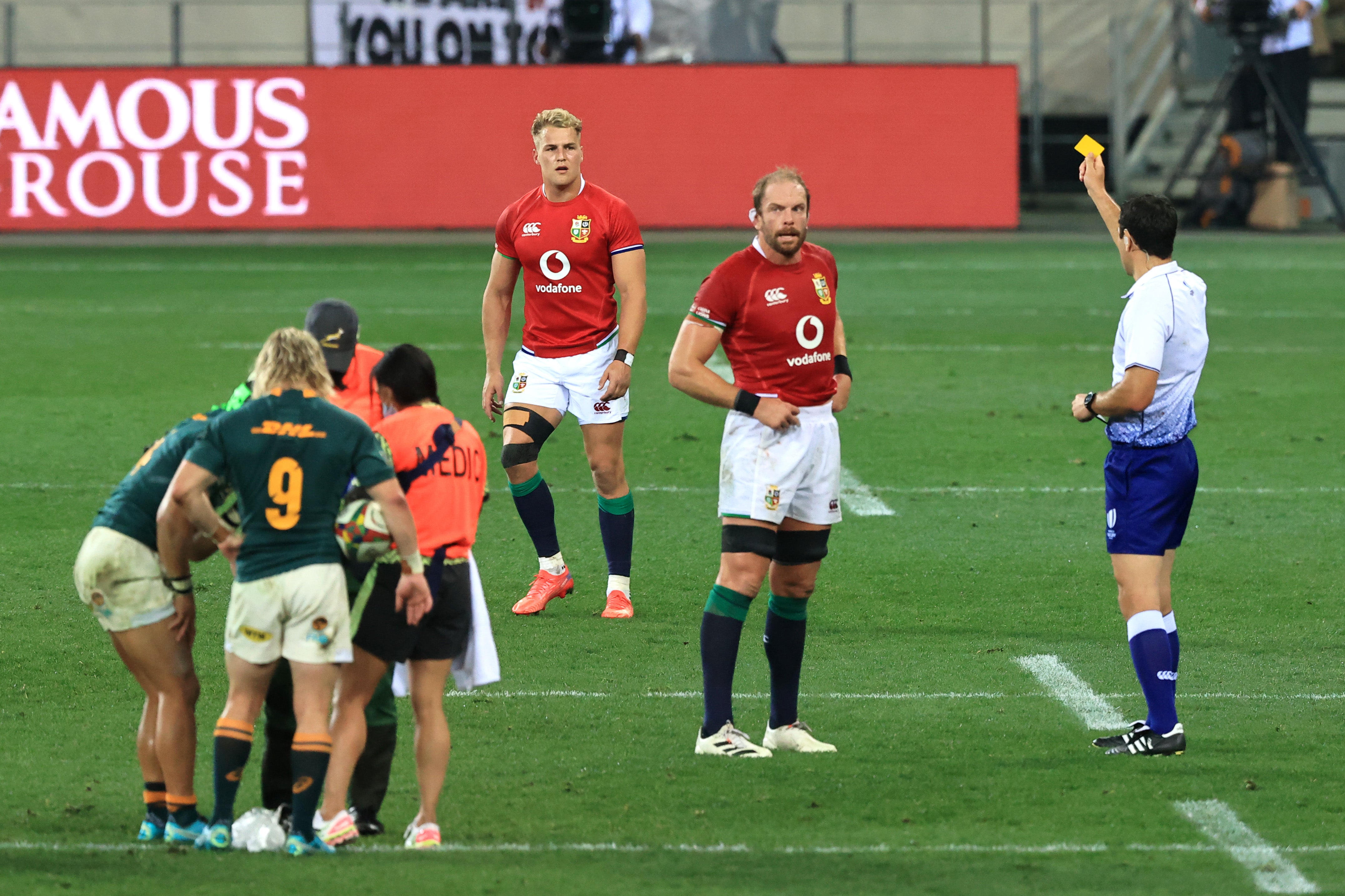 Referee Ben O'Keeffe shows a yellow card to Duhan van der Merwe of British & Irish Lions