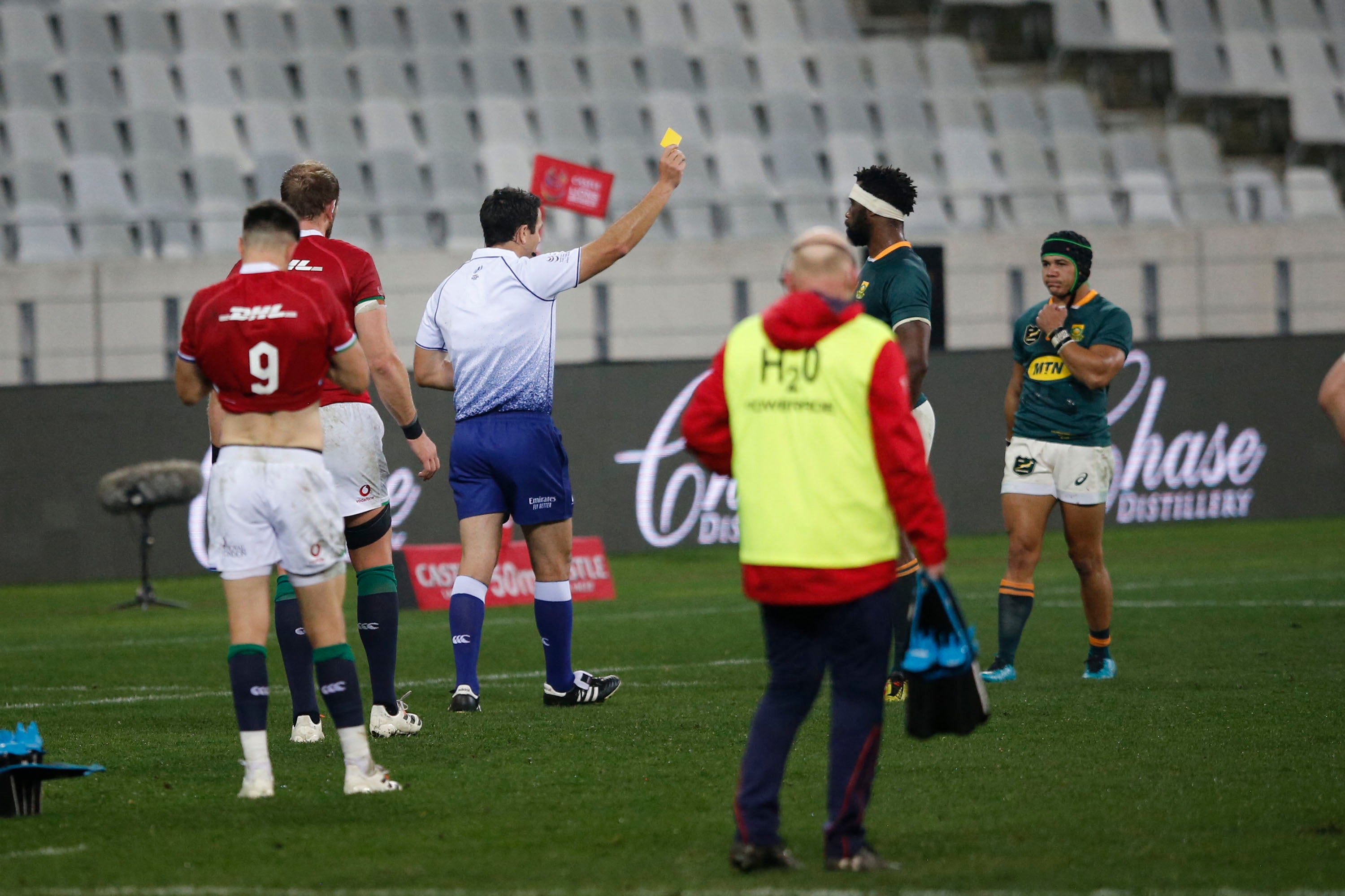 Match referee Ben O’Keefe shows the yellow card South Africa’s wing Cheslin Kolbe