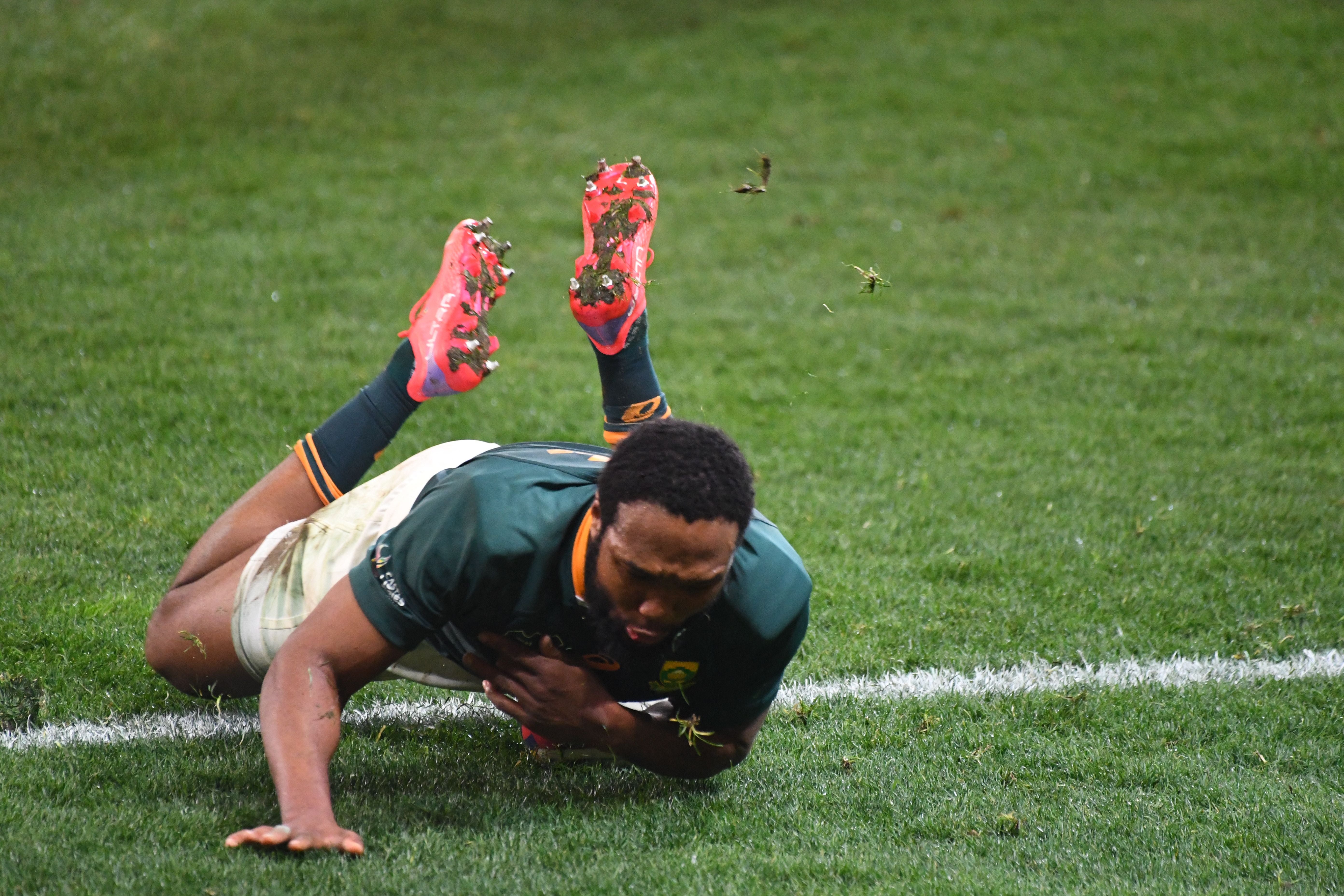 South Africa’s center Lukhanyo Am scores a try