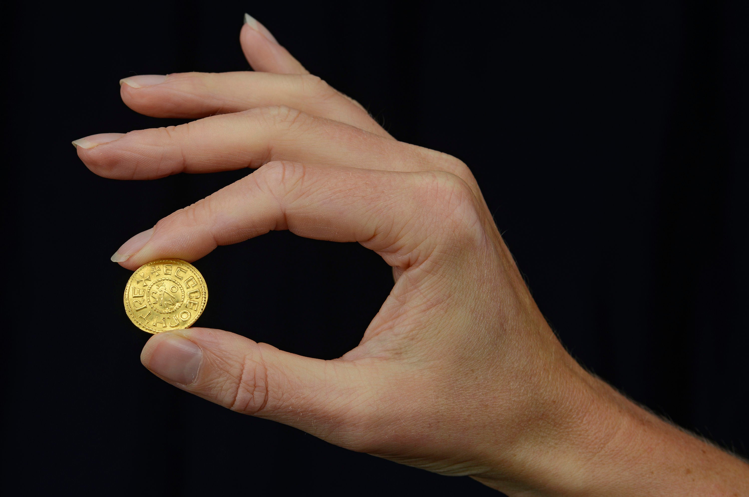 An Anglo-Saxon coin discovered by a metal detectorist which is set to fetch up to £200,000 at auction