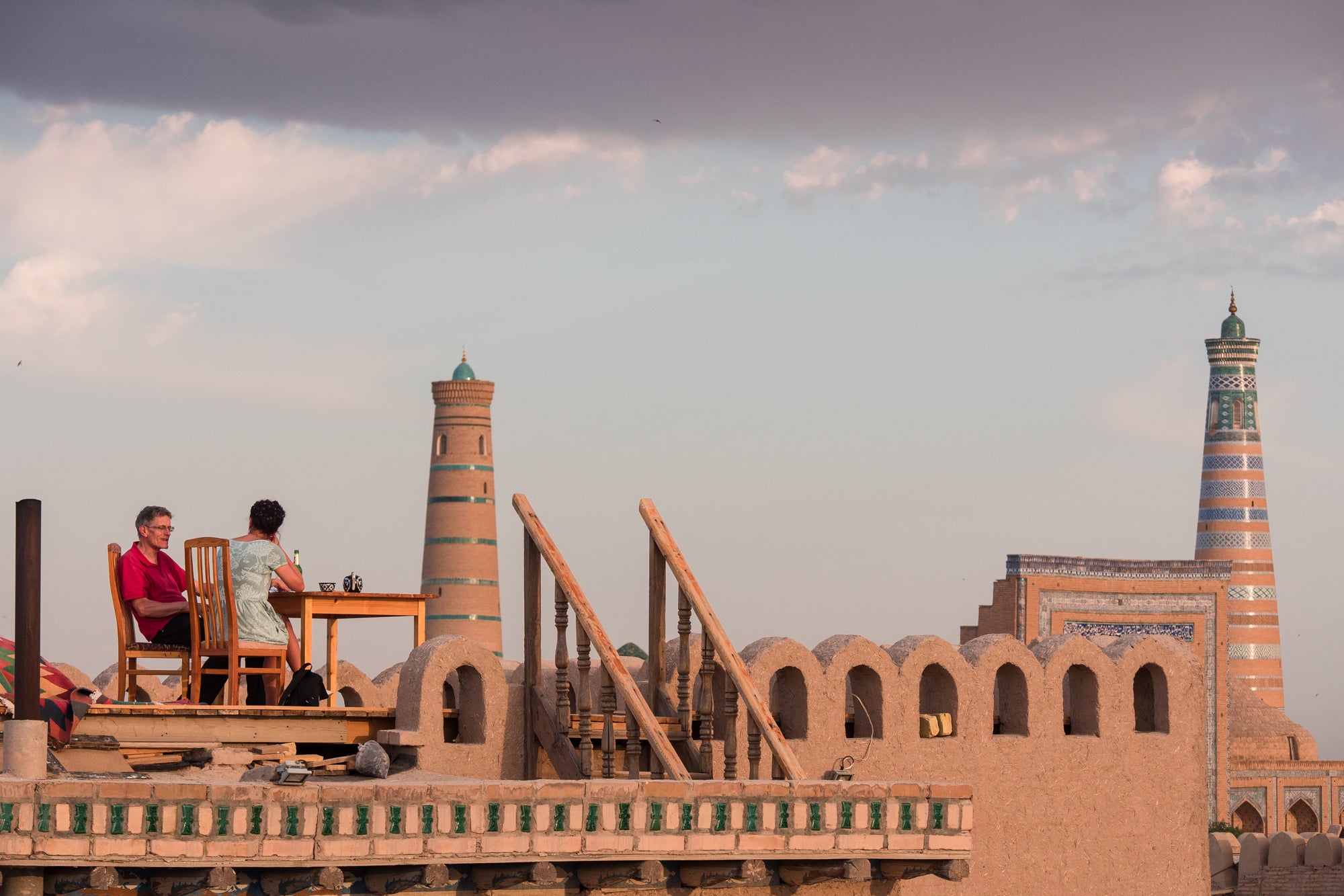 The sun sets over the mosques and minarets of Khiva