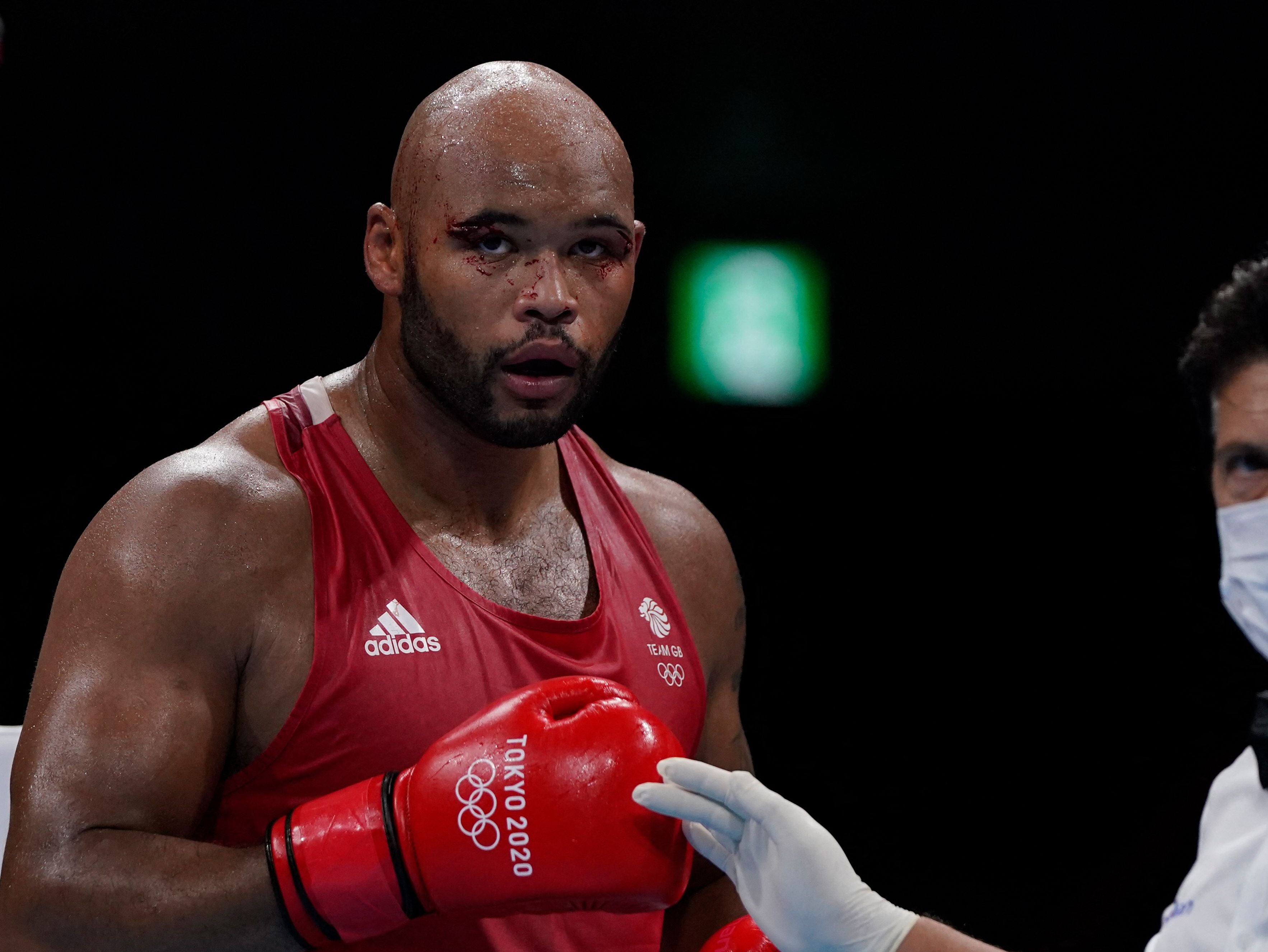 Frazer Clarke reacts after winning after the disqualification of France's Mourad Aliev