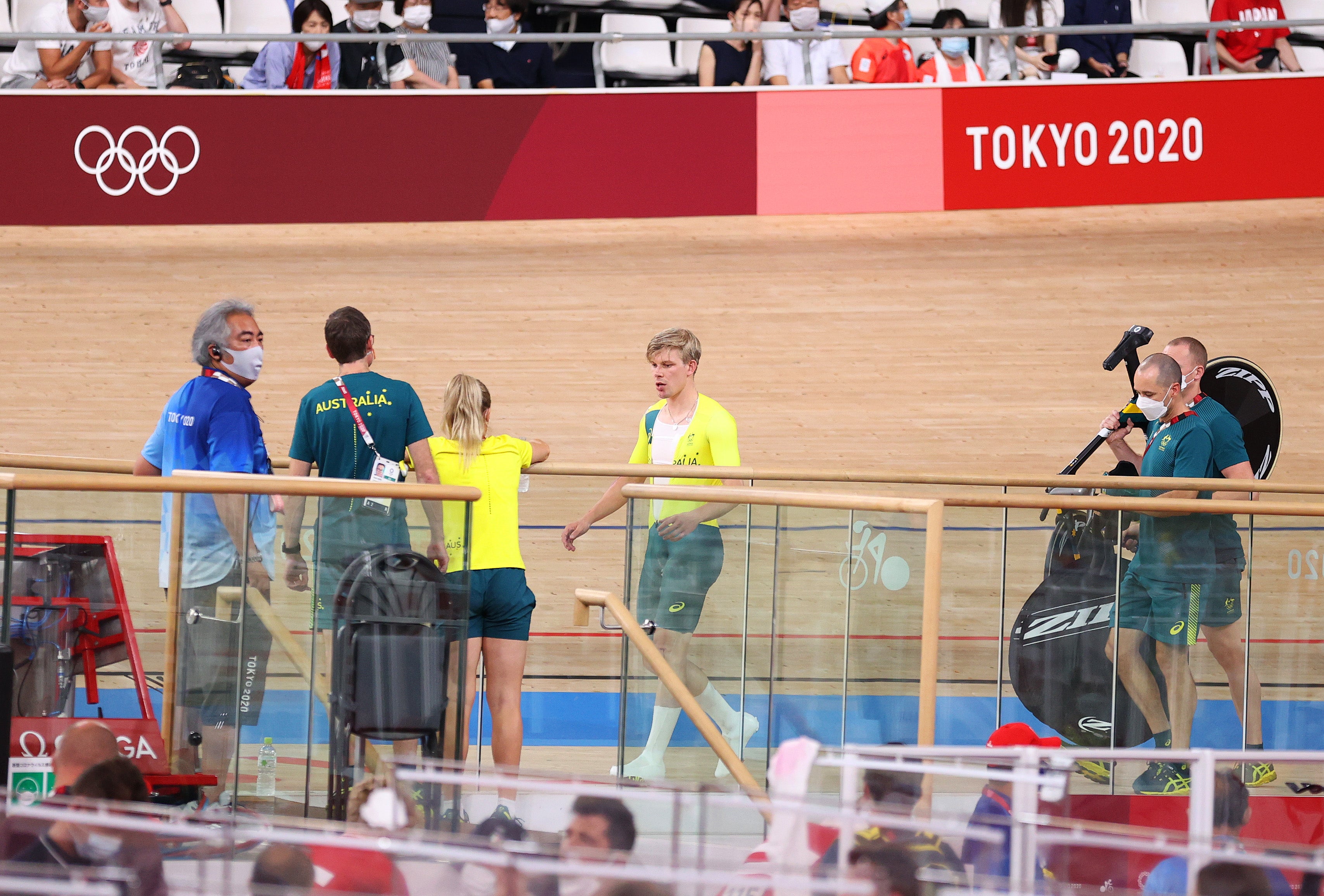 Alex Porter of Team Australia after his fall is attended by its staff