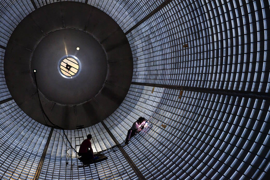 Welders fix holes inside a liquid hydrogen tank for Nasa’s Space Launch System