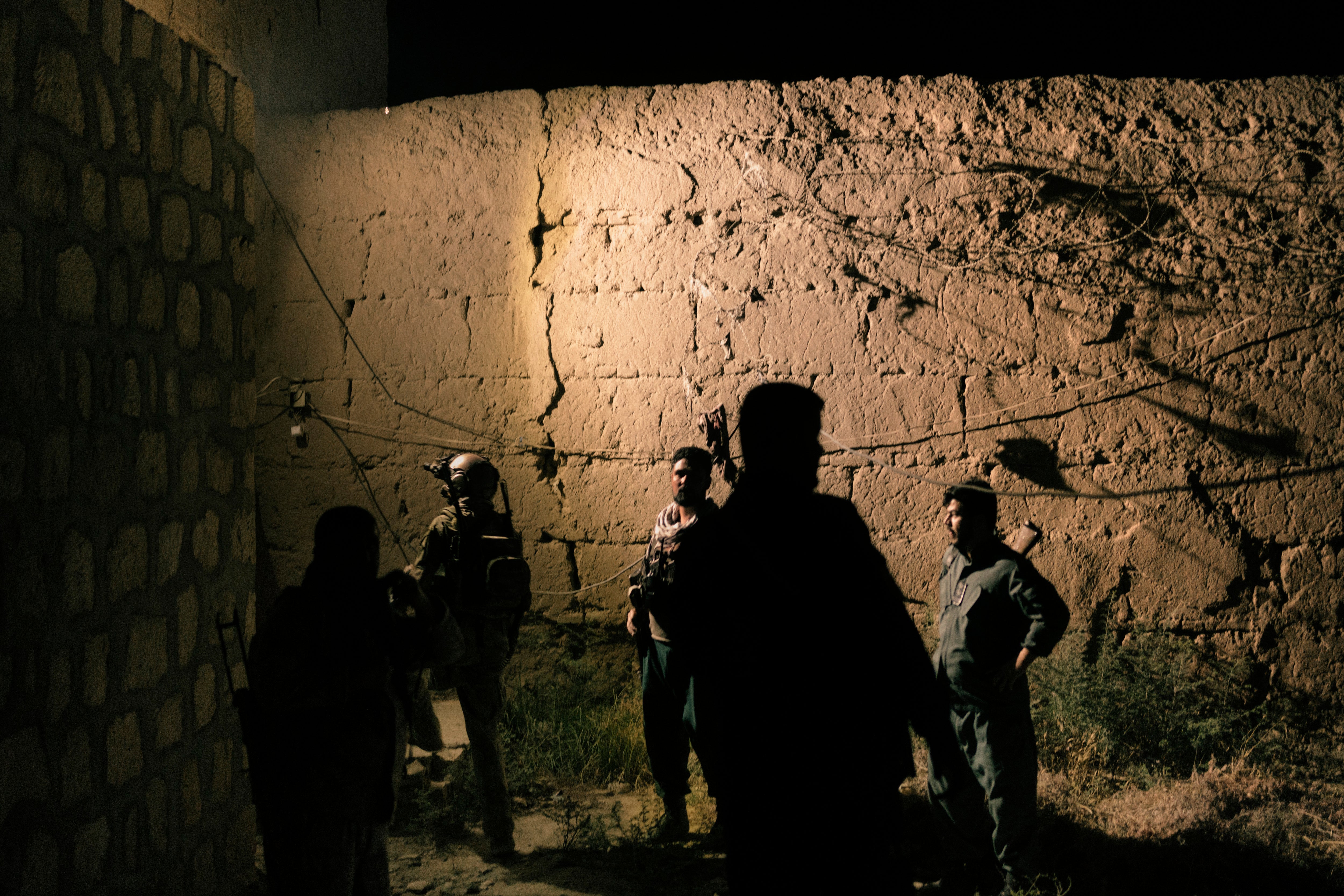 Members of the Afghan special forces check the perimeter of Kunduz prison