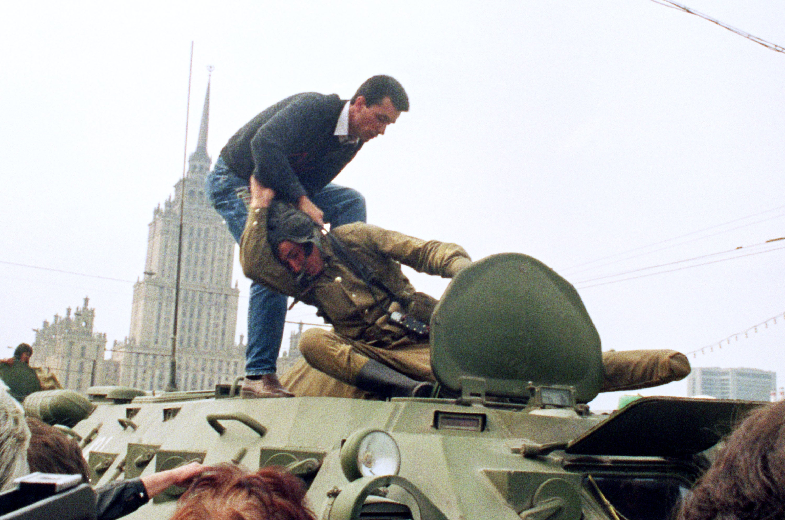 19 August 1991: a pro-democracy demonstrator tackles a Soviet soldier on top of a tank parked in front of the Russian Federation building