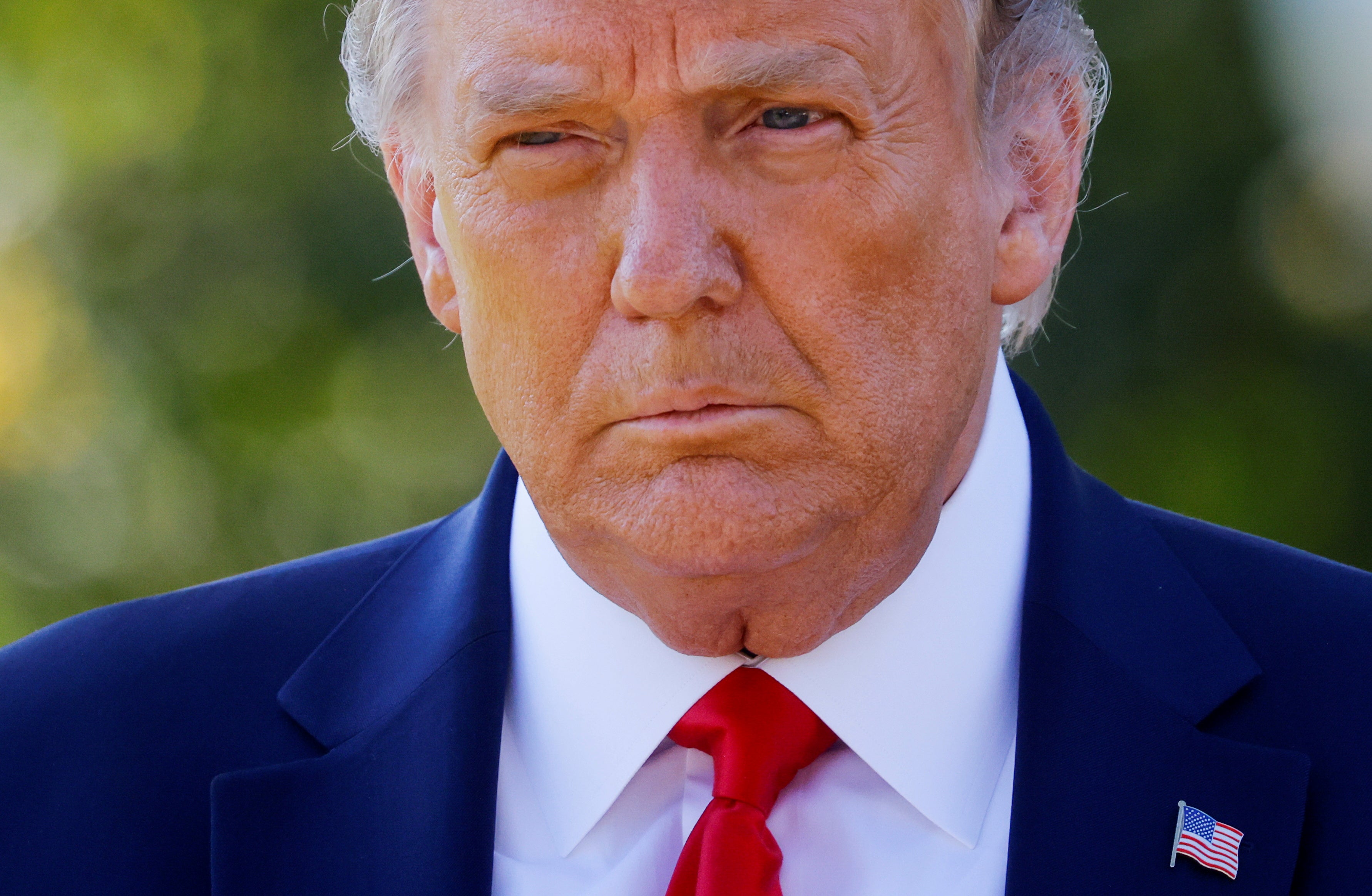 File image: Then-US President Donald Trump approaches reporters as he departs on campaign travel to Minnesota from the South Lawn at the White House in Washington, US, 30 September, 2020