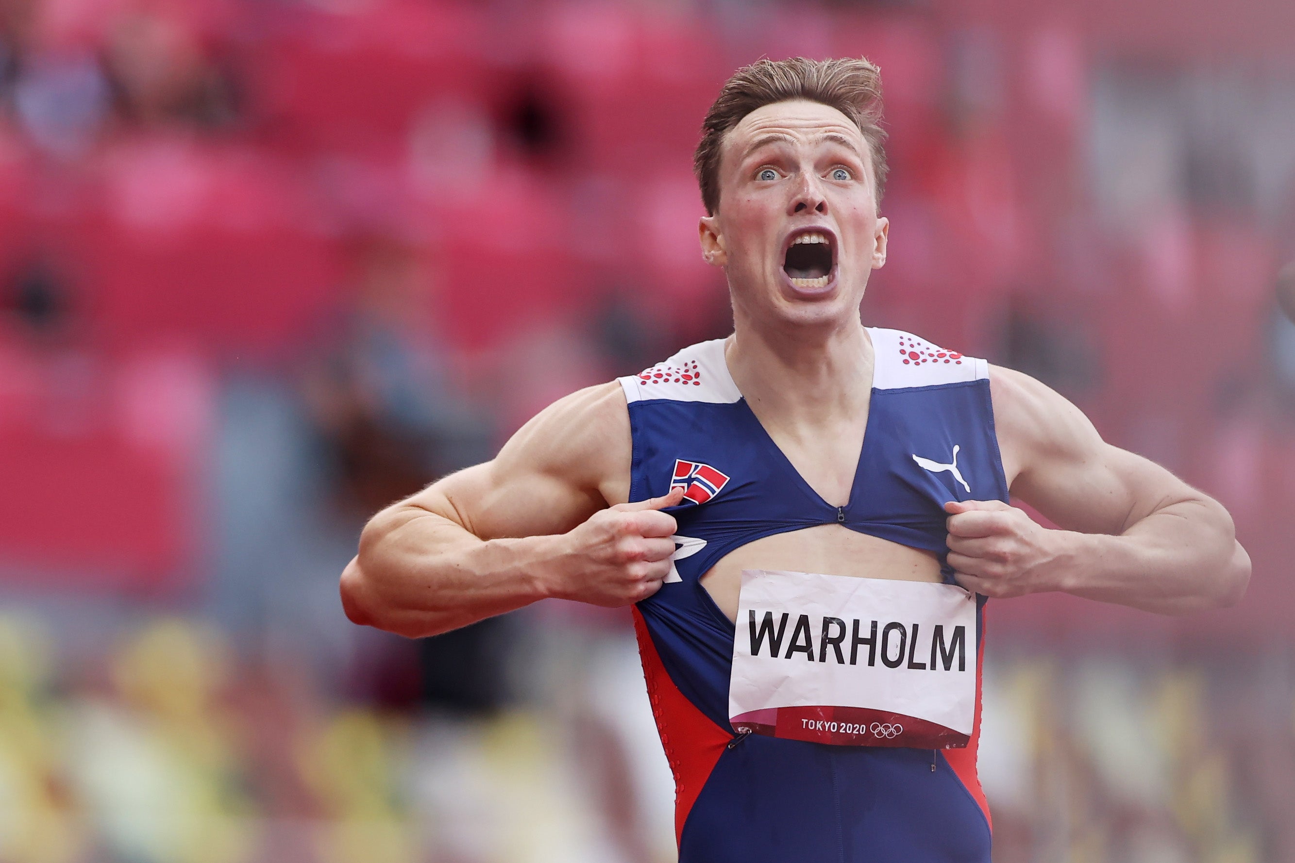 Warholm rips open his shirt after wining gold