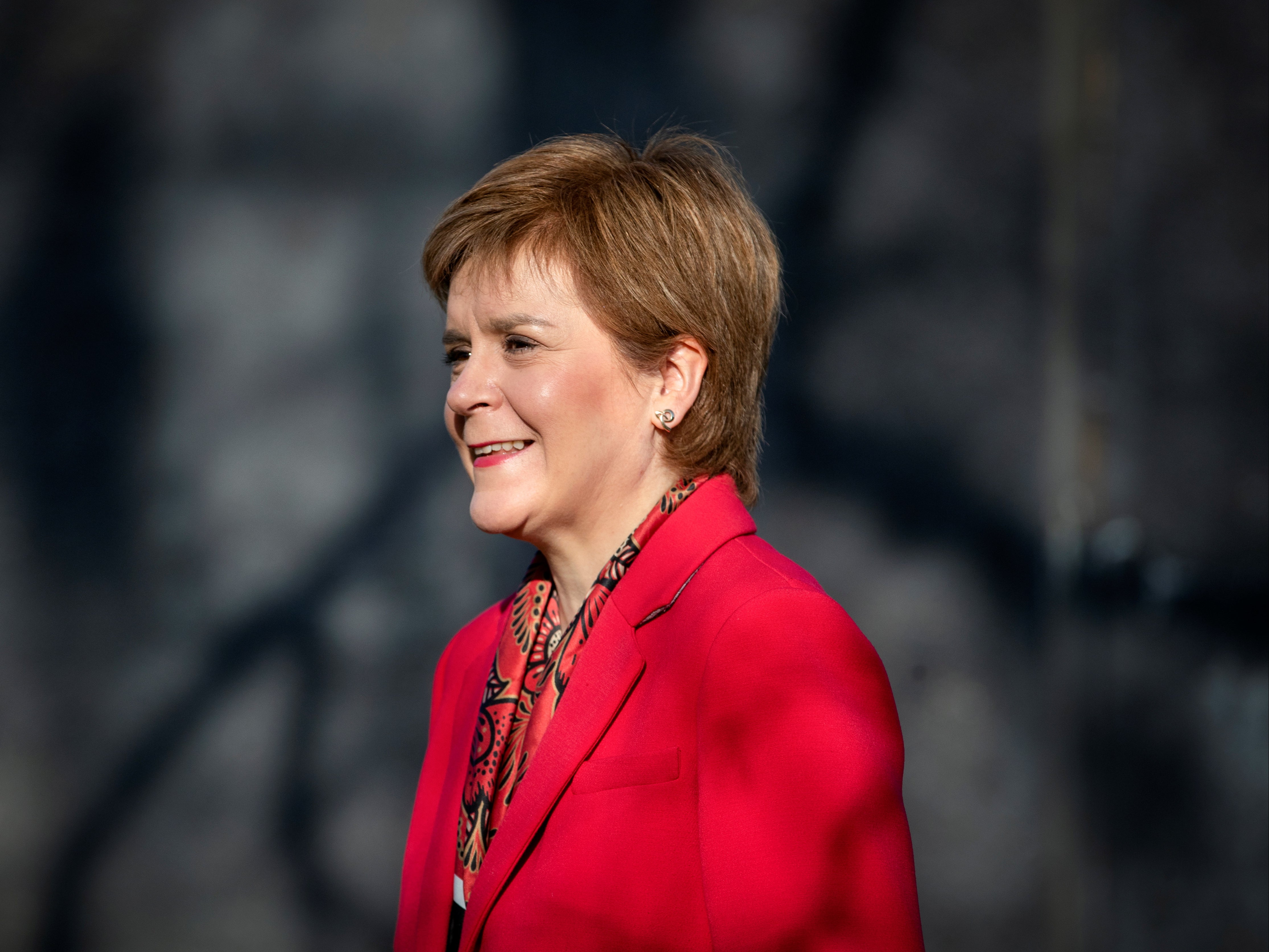 Scotland's First Minister Nicola Sturgeon speaks to the media as she visits the Thornliebank Dental Care centre during the election campaign in Glasgow