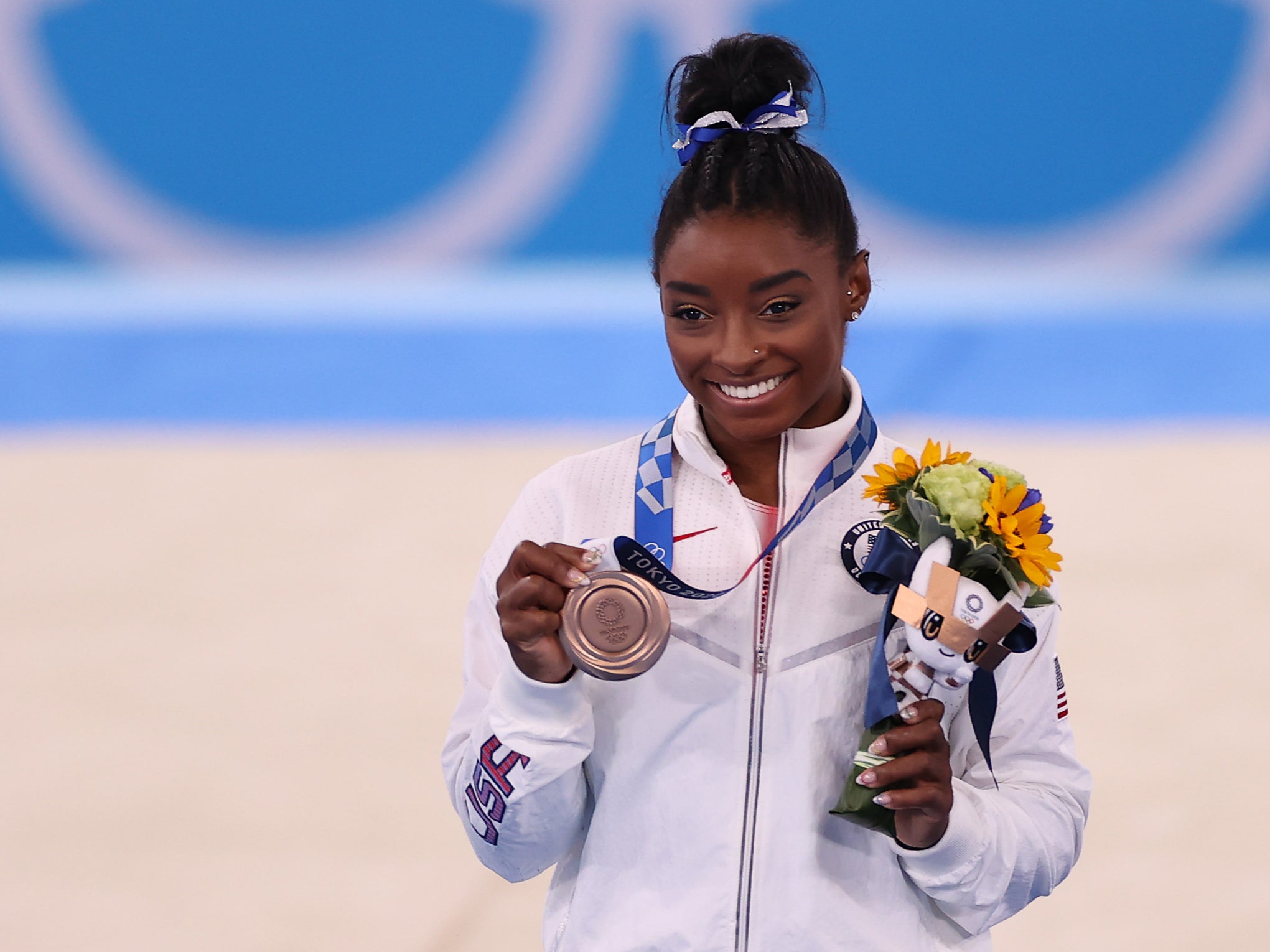 Simone Biles of Team United States poses with the bronze medal