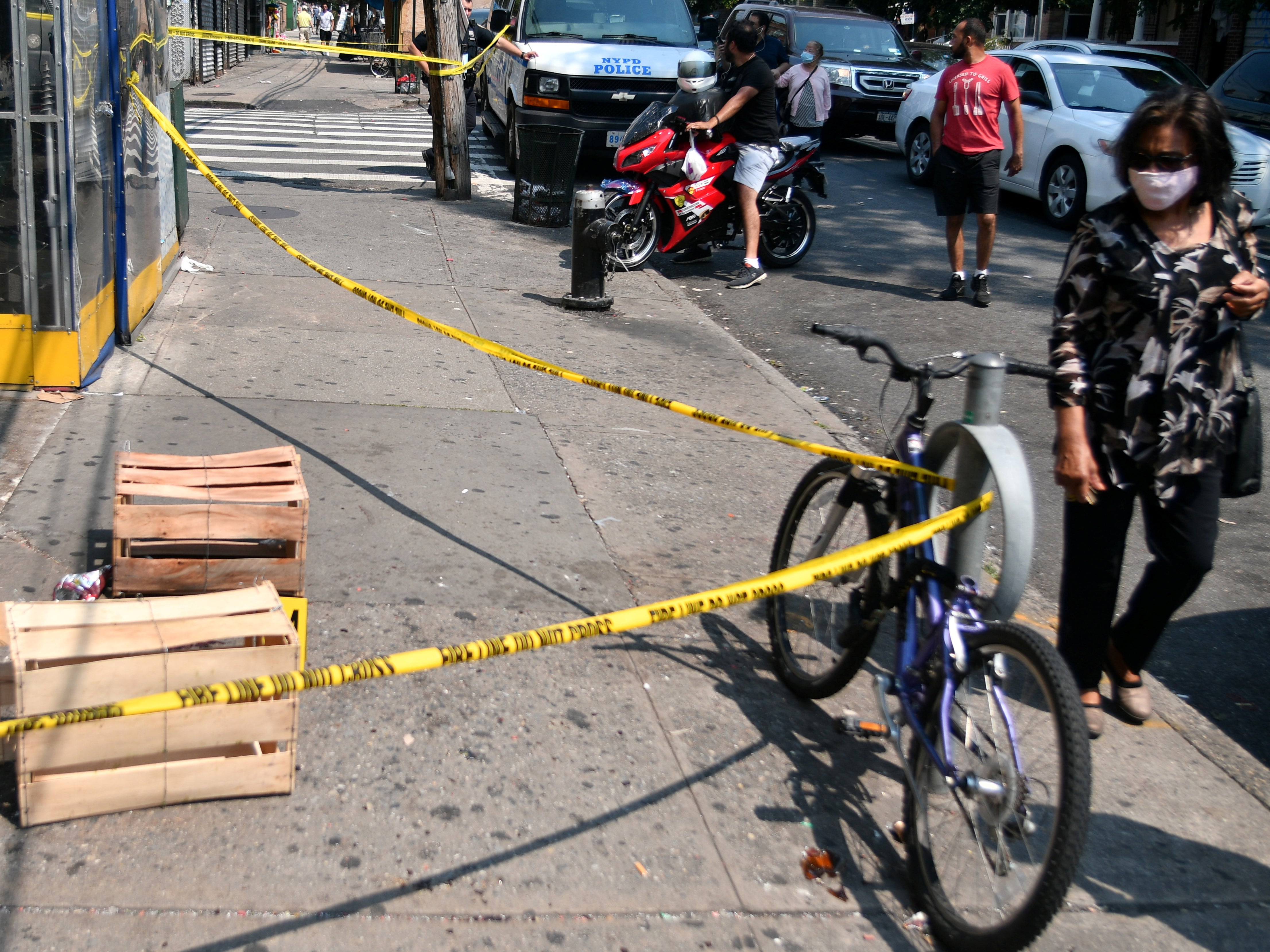 Two hooded and masked shooters shot 10 people in front of a barbershop in Queens, New York