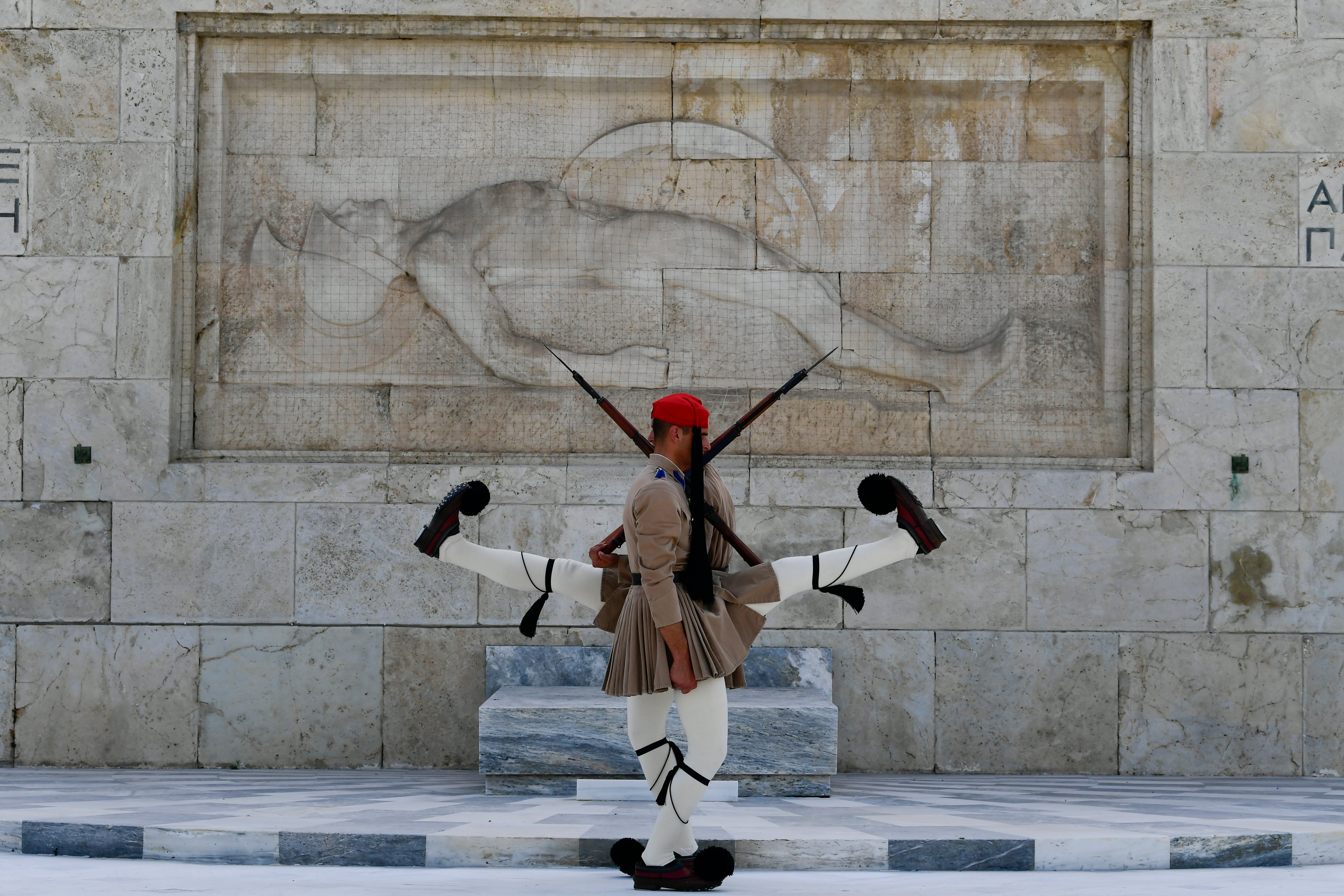 Evzones of the Greek Presidential Guard in front of the Tomb of the Unknown Soldier in Athens
