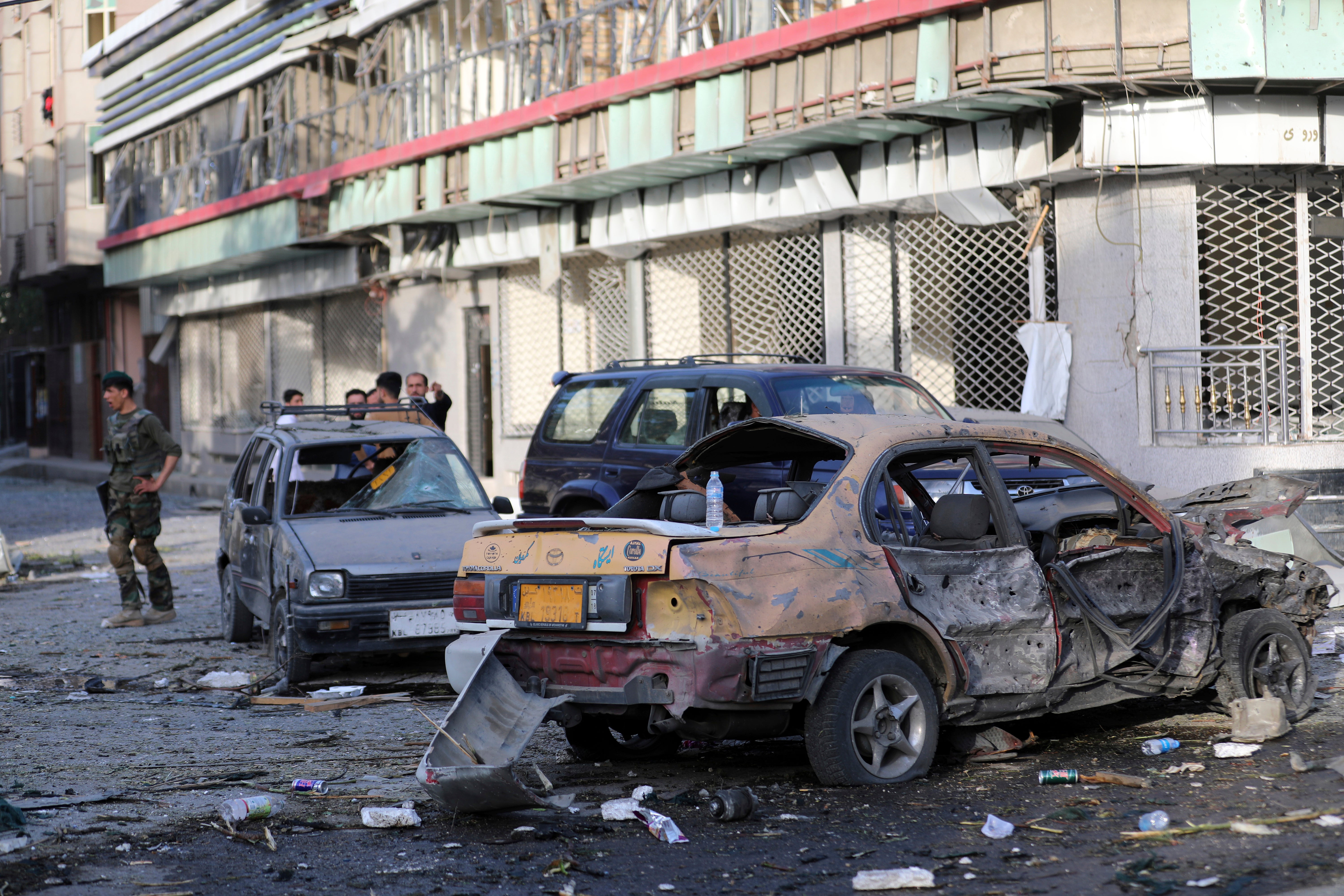 An Afghan national army soldier stands guard following an explosion in Kabul