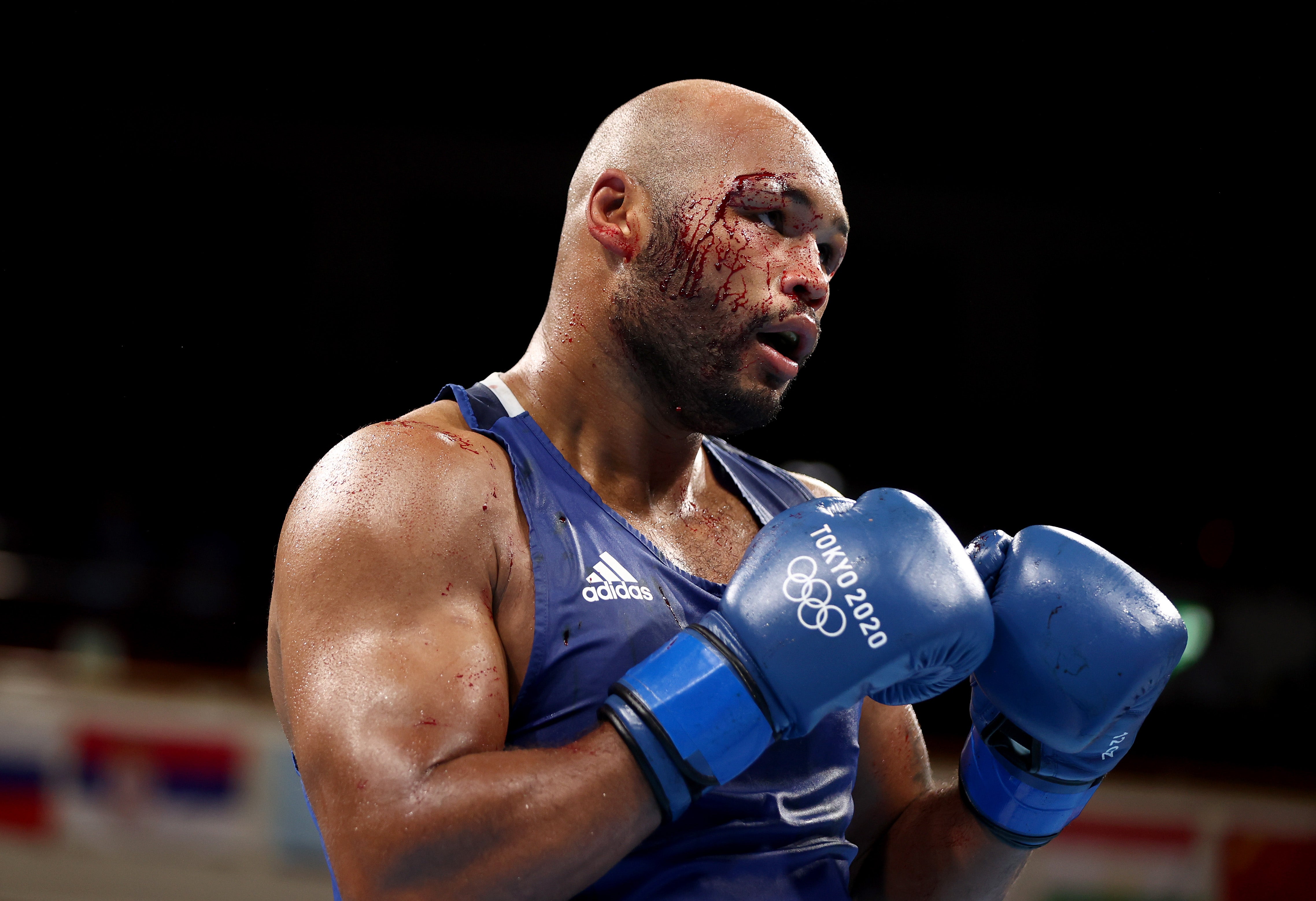 Frazer Clarke of Team Great Britain gets a cut in his semi-final