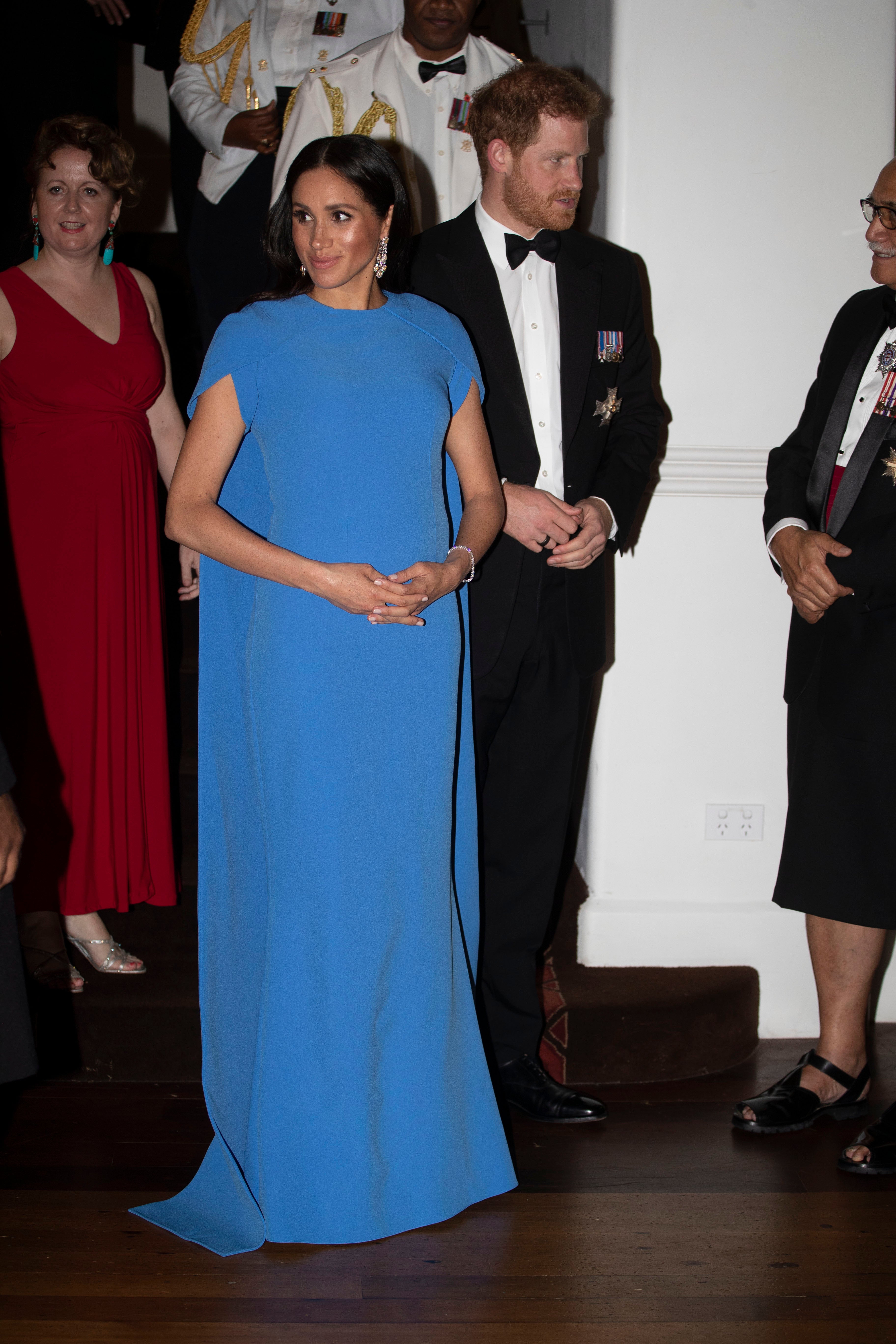 Meghan wore a cape dress.