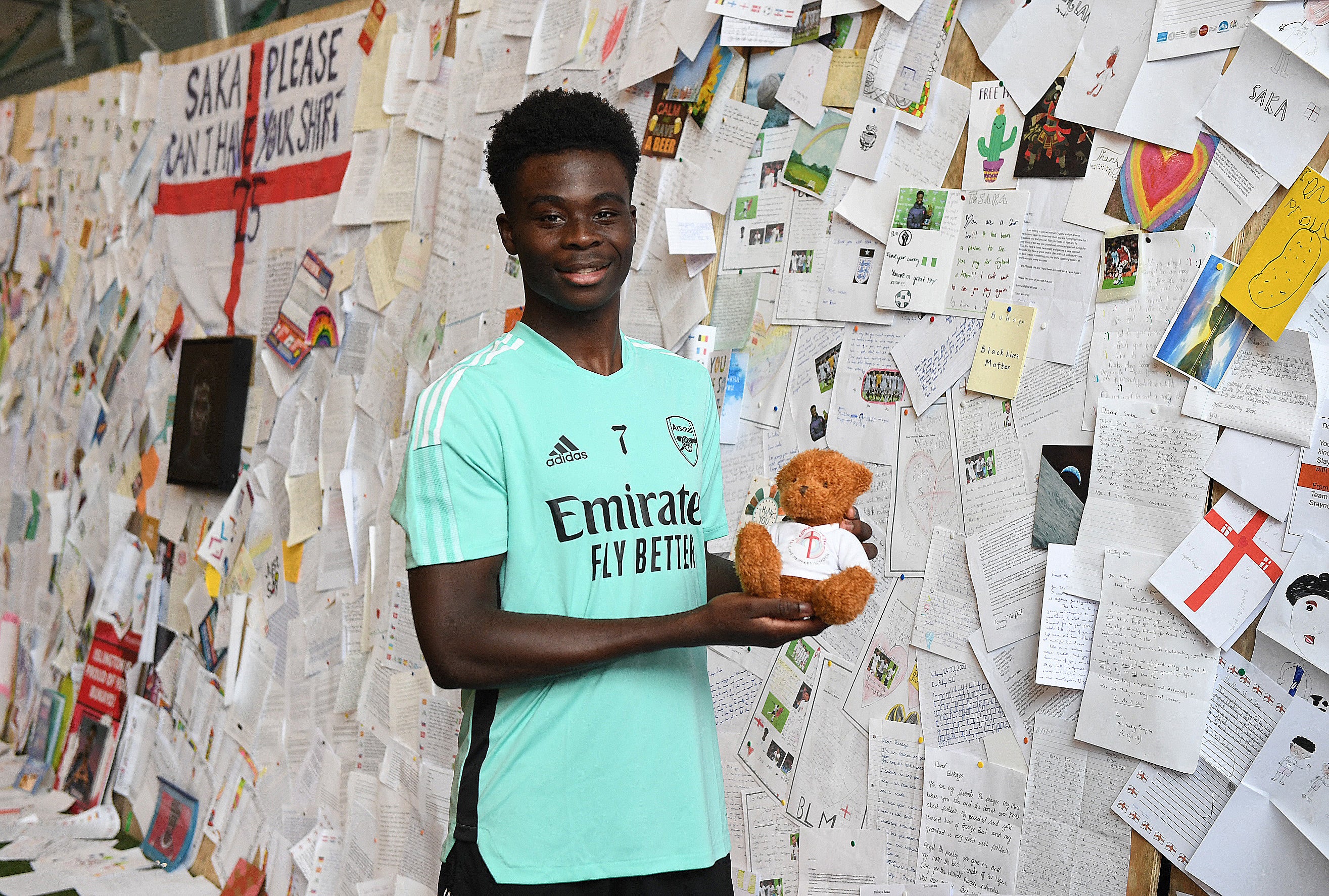 Saka with letters of support at Arsenal’s training ground in Hertfordshire