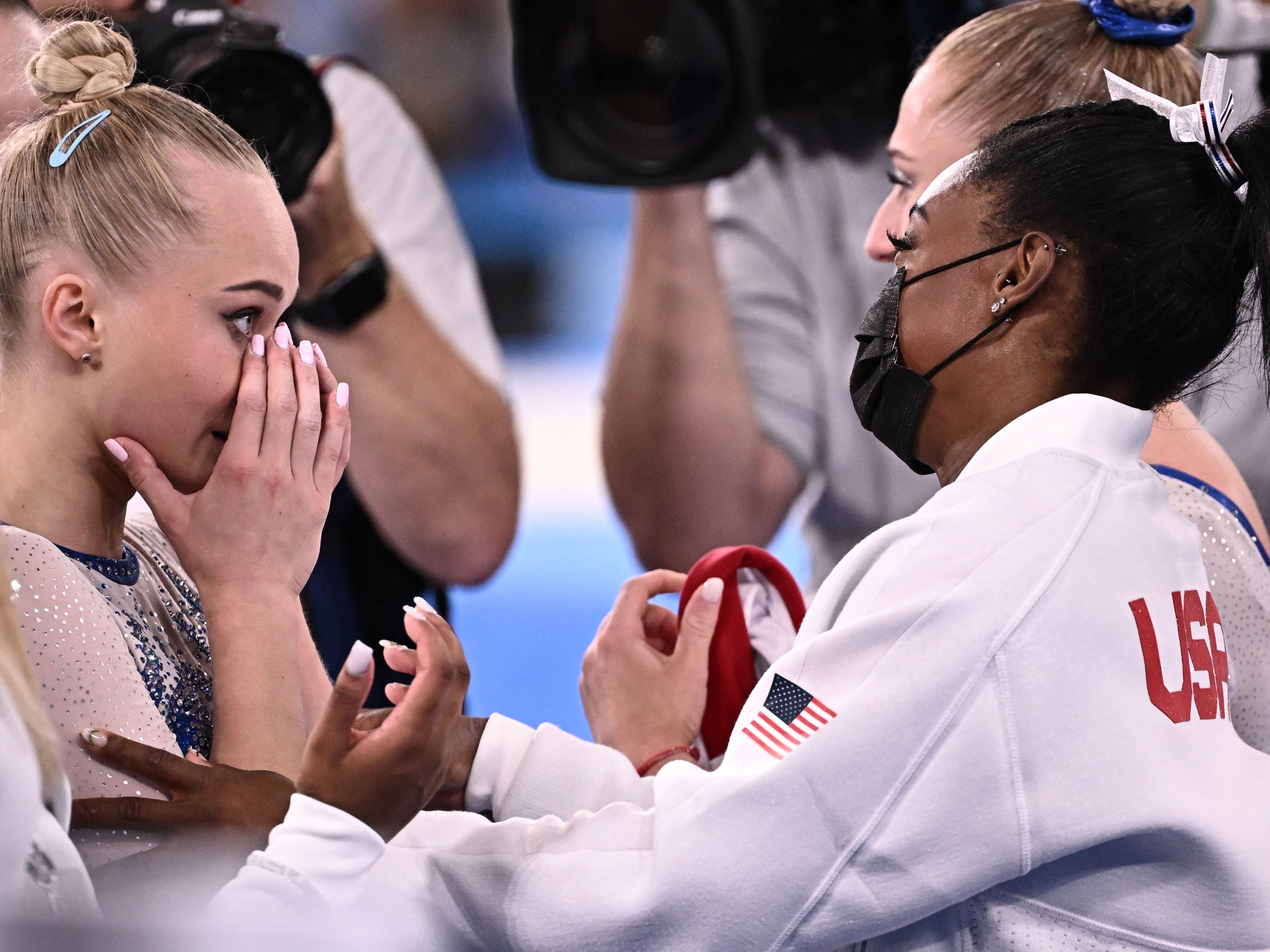 Simone Biles congratulates Russia’s Angelina Melnikova on her Olympics win