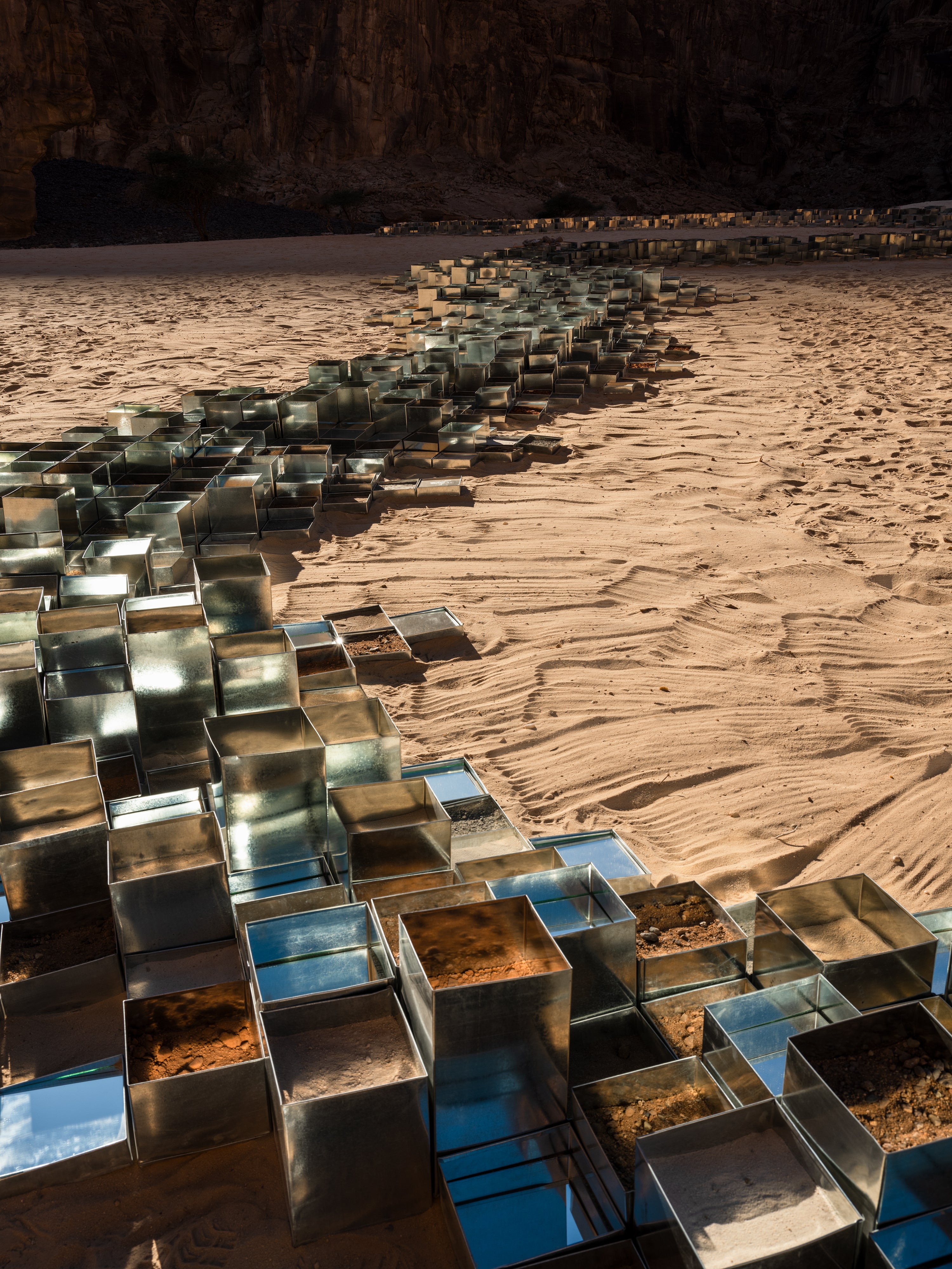 Jeddah-based artist Zahrah AlGhamdi arranged around 6,000 tin date containers to create an artwork that resembles a river