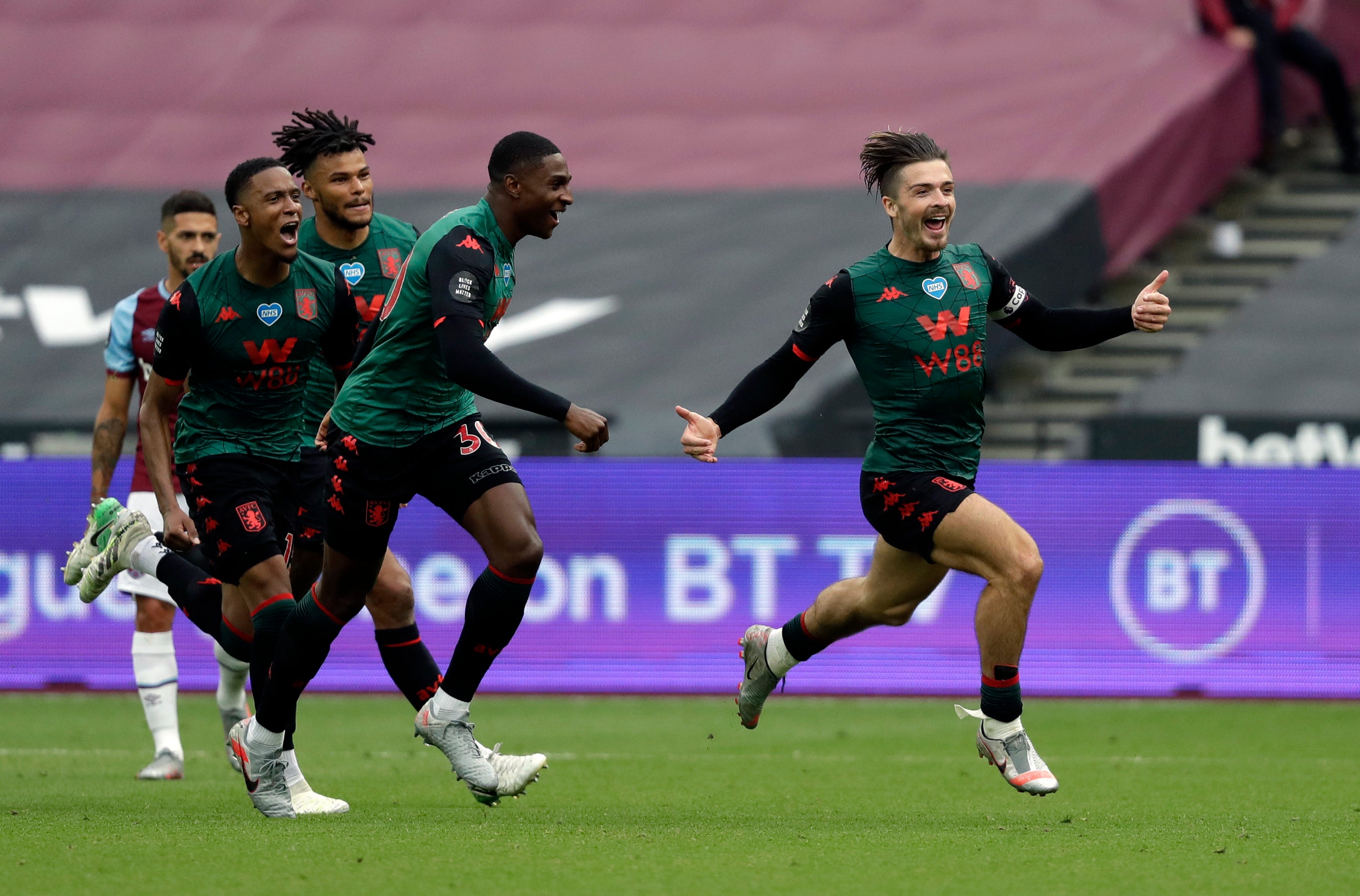 Grealish (right) celebrates his 84th-minute goal against West Ham at London Stadium that kept Aston Villa in the Premier League (Matt Dunham/PA)