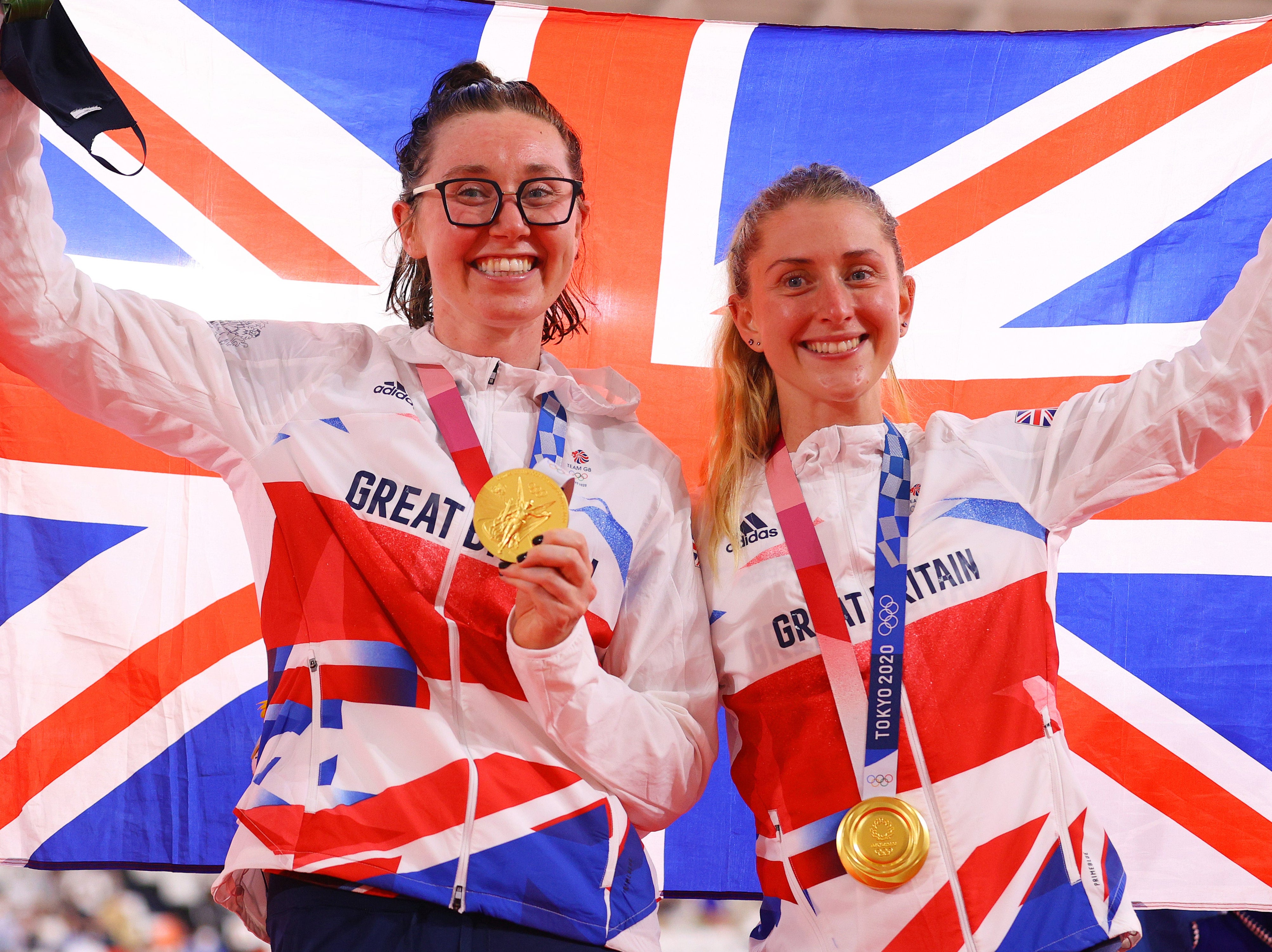 Katie Archibald and Laura Kenny celebrate with their gold medals