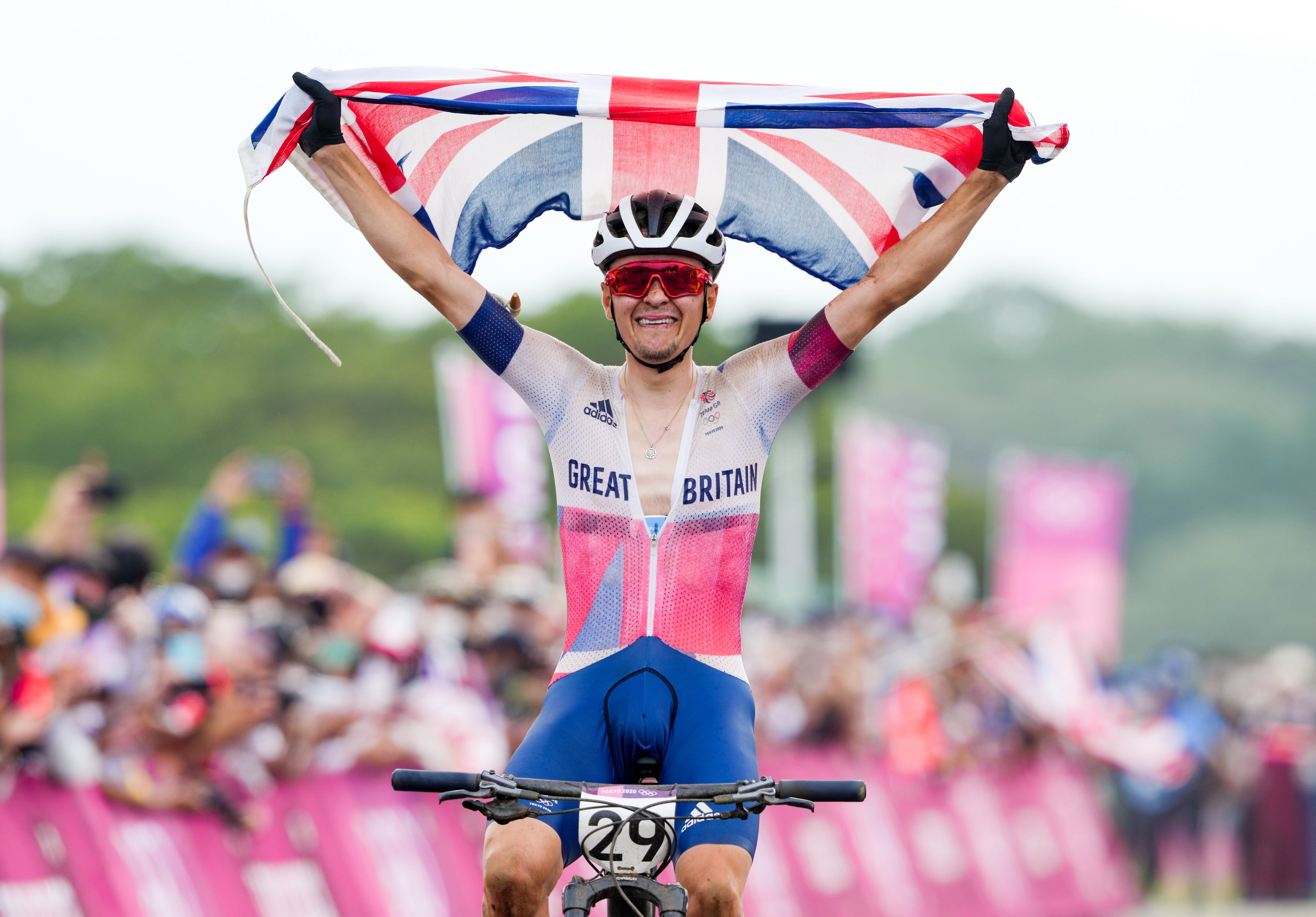 Great Britain’s Tom Pidcock celebrates winning gold in the men’s mountain bike.