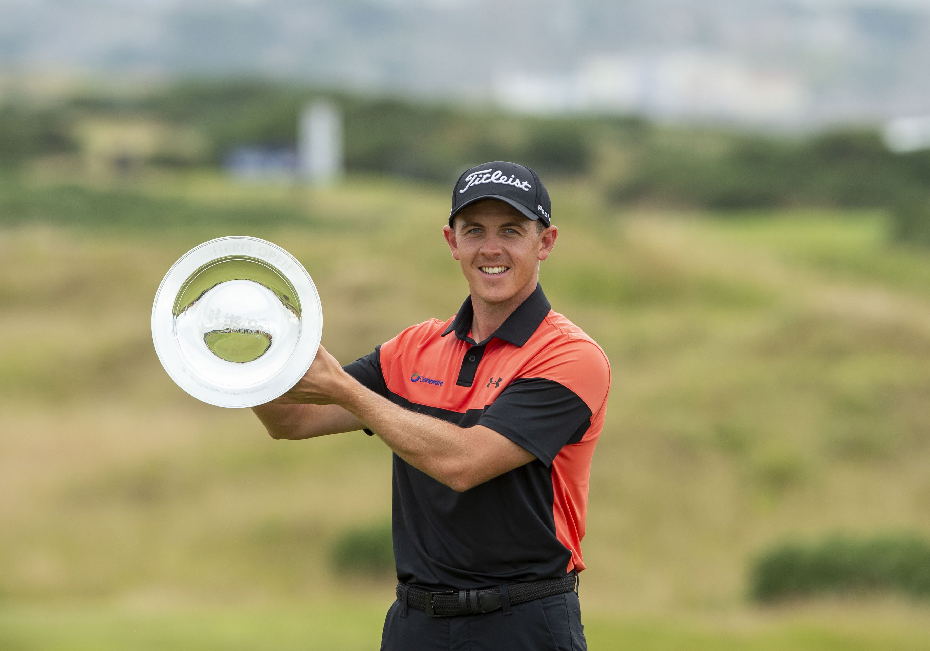 Grant Forrest holds the trophy on the 18th after winning the Hero Open at Fairmont St Andrews (Ian Rutherford/PA)