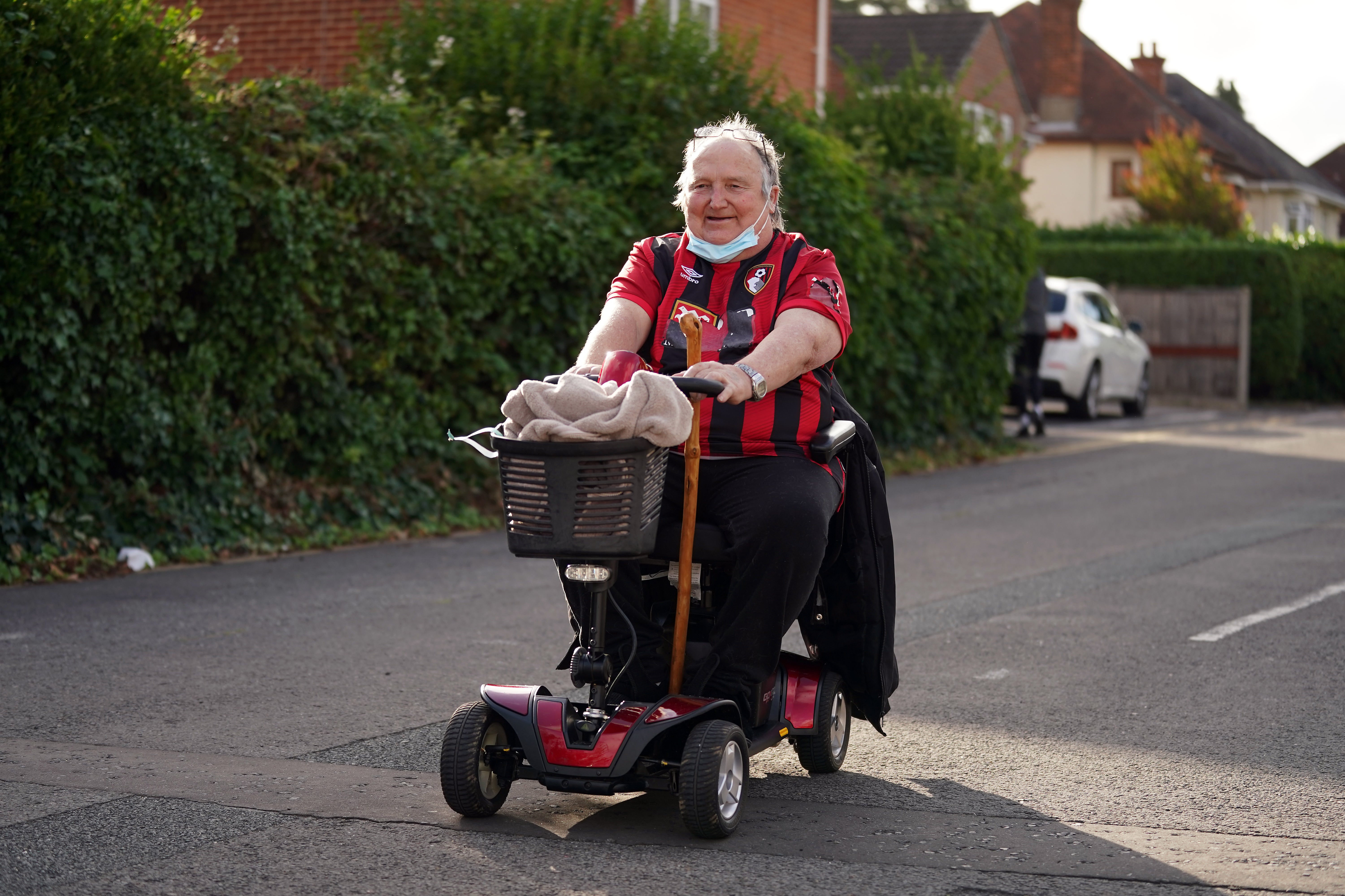 A Bournemouth fan arrives for his team’s Championship match against West Brom on Friday (John Walton/PA)