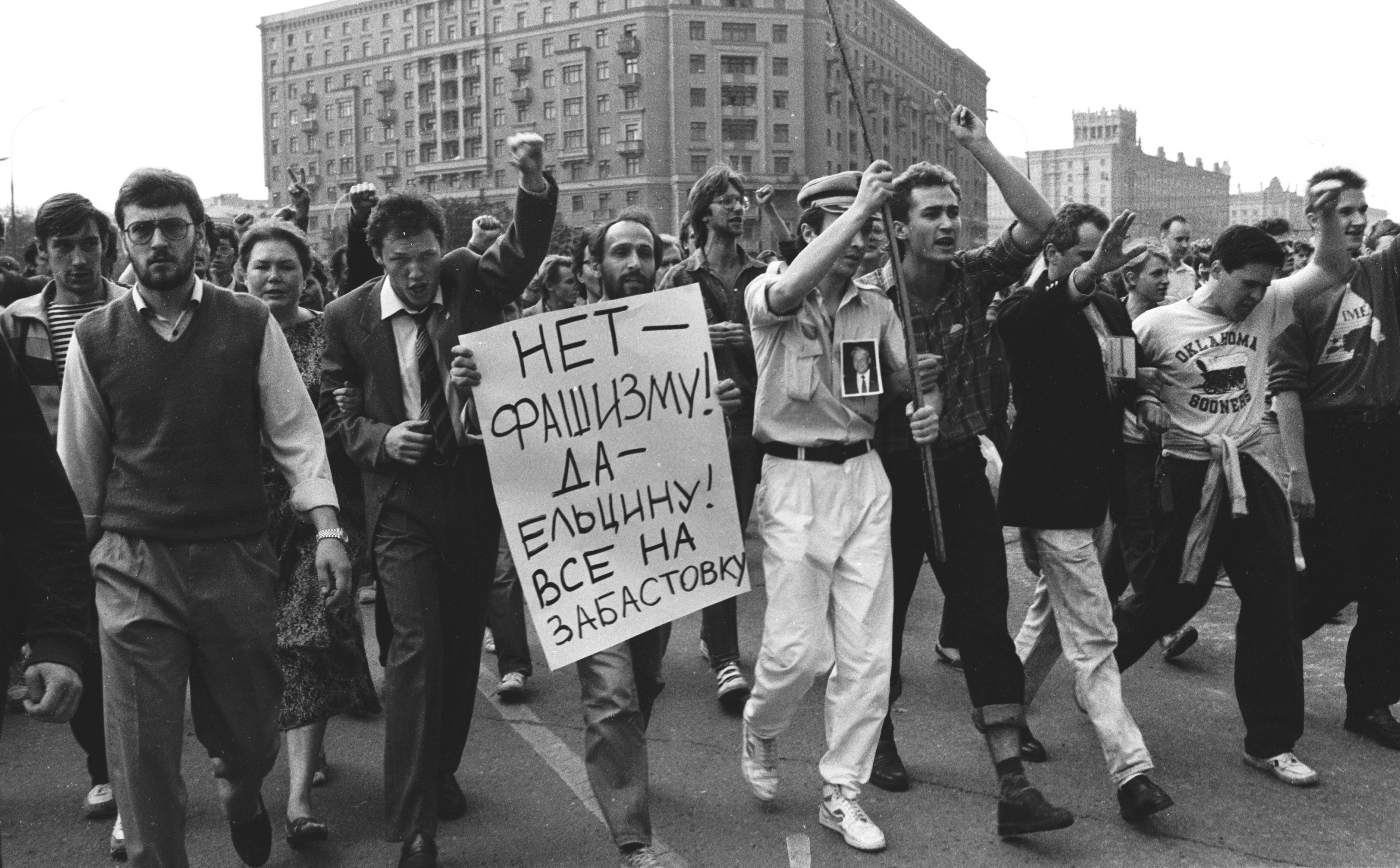 People march towards the Russian White House with posters saying: No to Facism! Yes to Yeltsin! All on Strike!