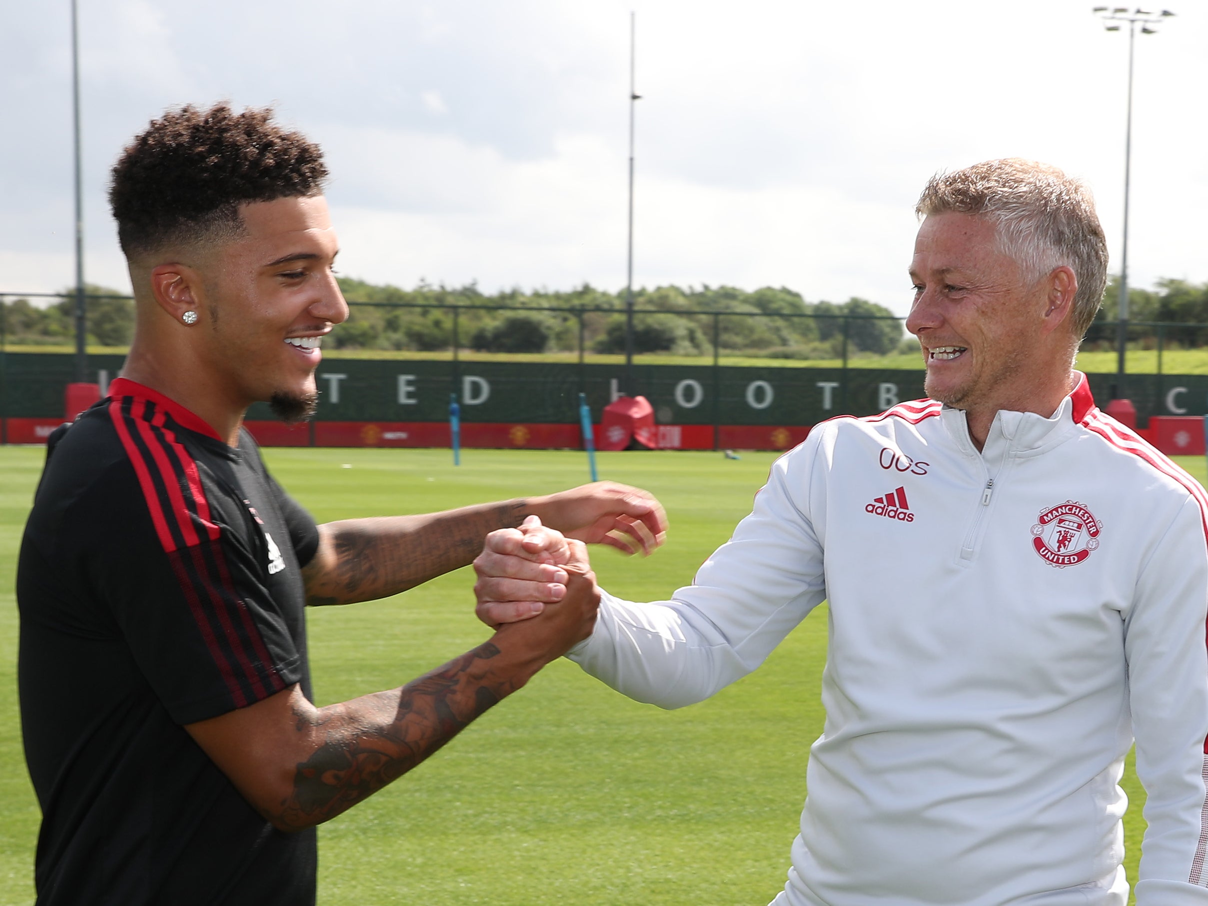 Manchester United coach Solskjaer with Jadon Sancho