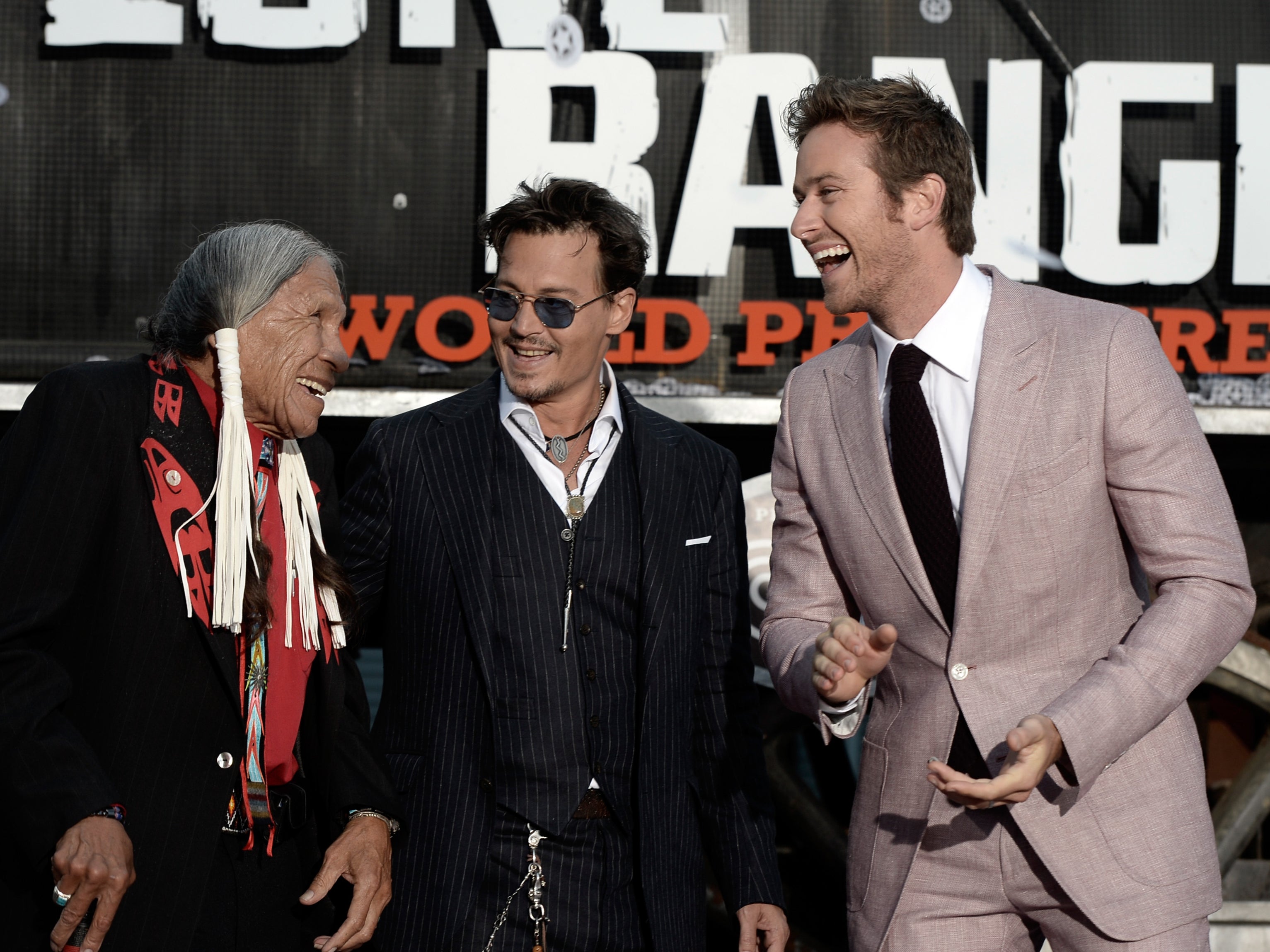 Saginaw Grant with Johnny Depp, and Armie Hammer at ‘The Lone Ranger’ premiere in 2013