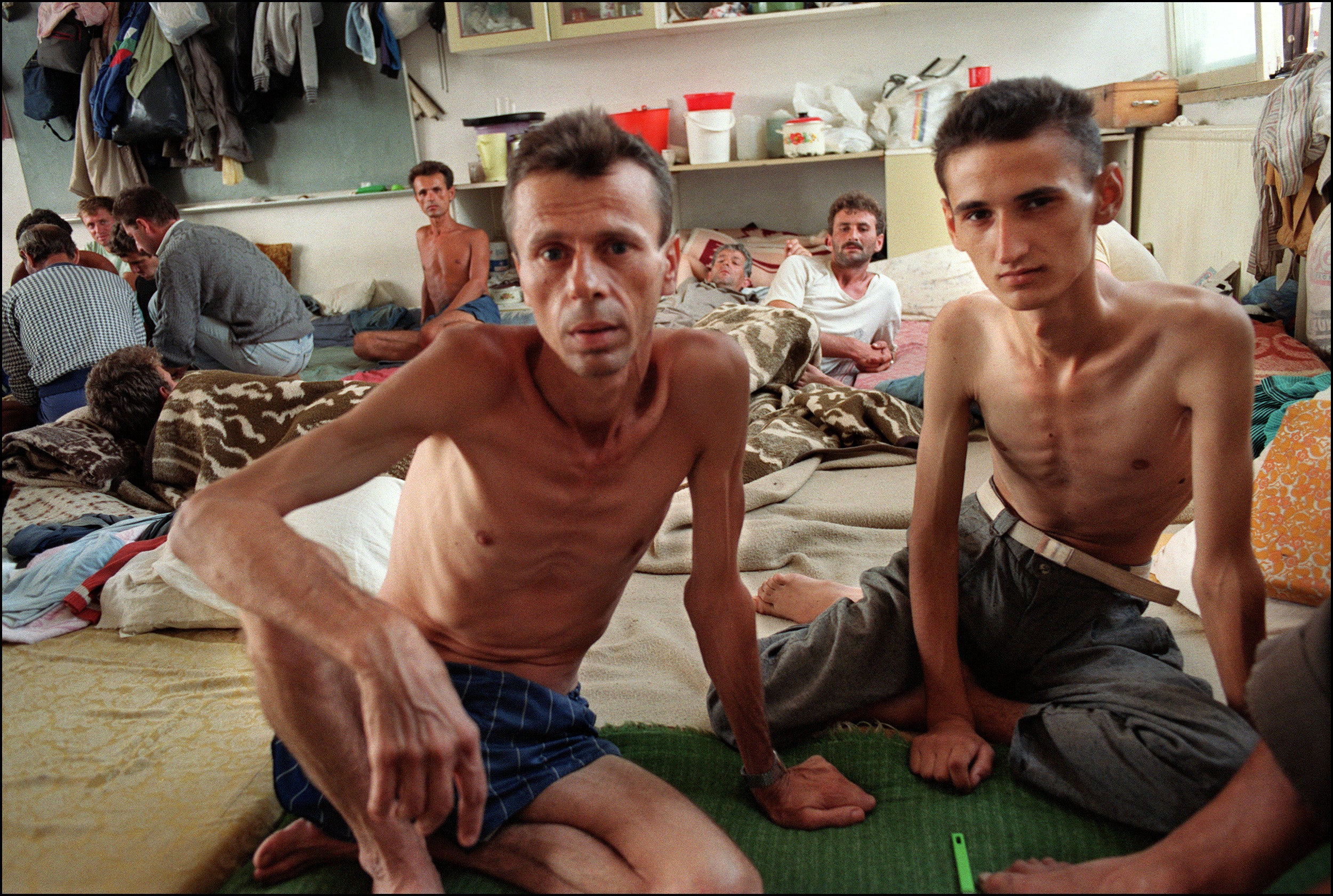 Prisoners are interviewed during a visit of journalists and members of the Red Cross to the Serb camp in Tjernopolje, near Prijedor northwest Bosnia, 13 August 1992