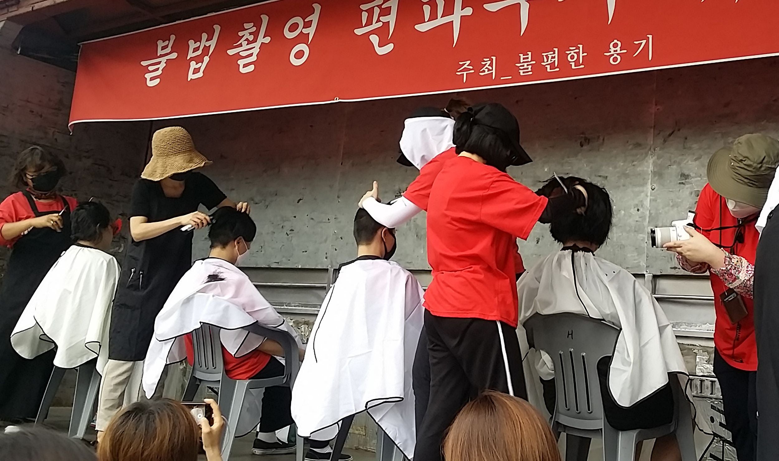 South Korean women having their heads shaved during a protest against secretly-filmed spycam pornography in Seoul