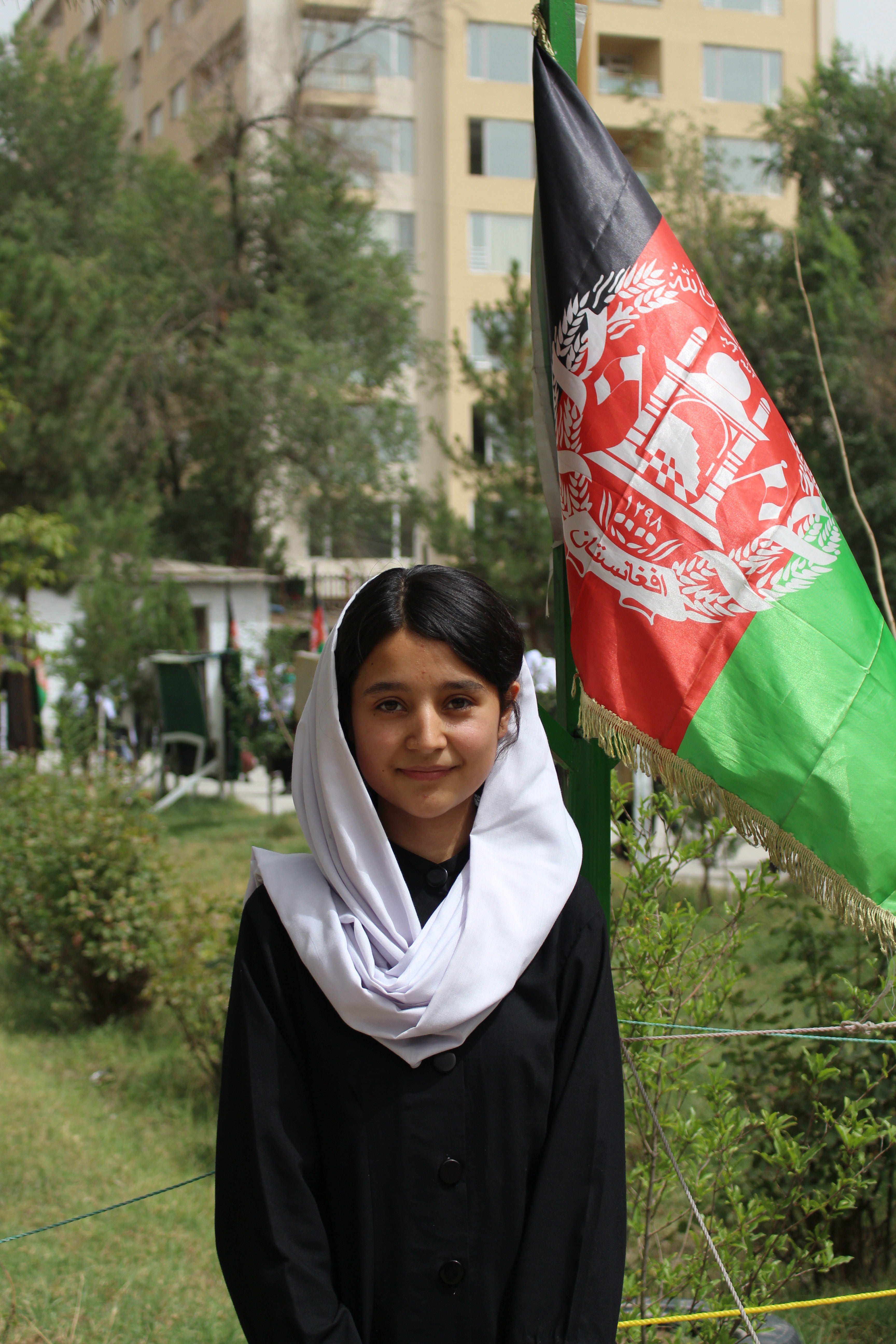 Behishta Amini, 18, in the garden of Zarghoona High School in Kabul