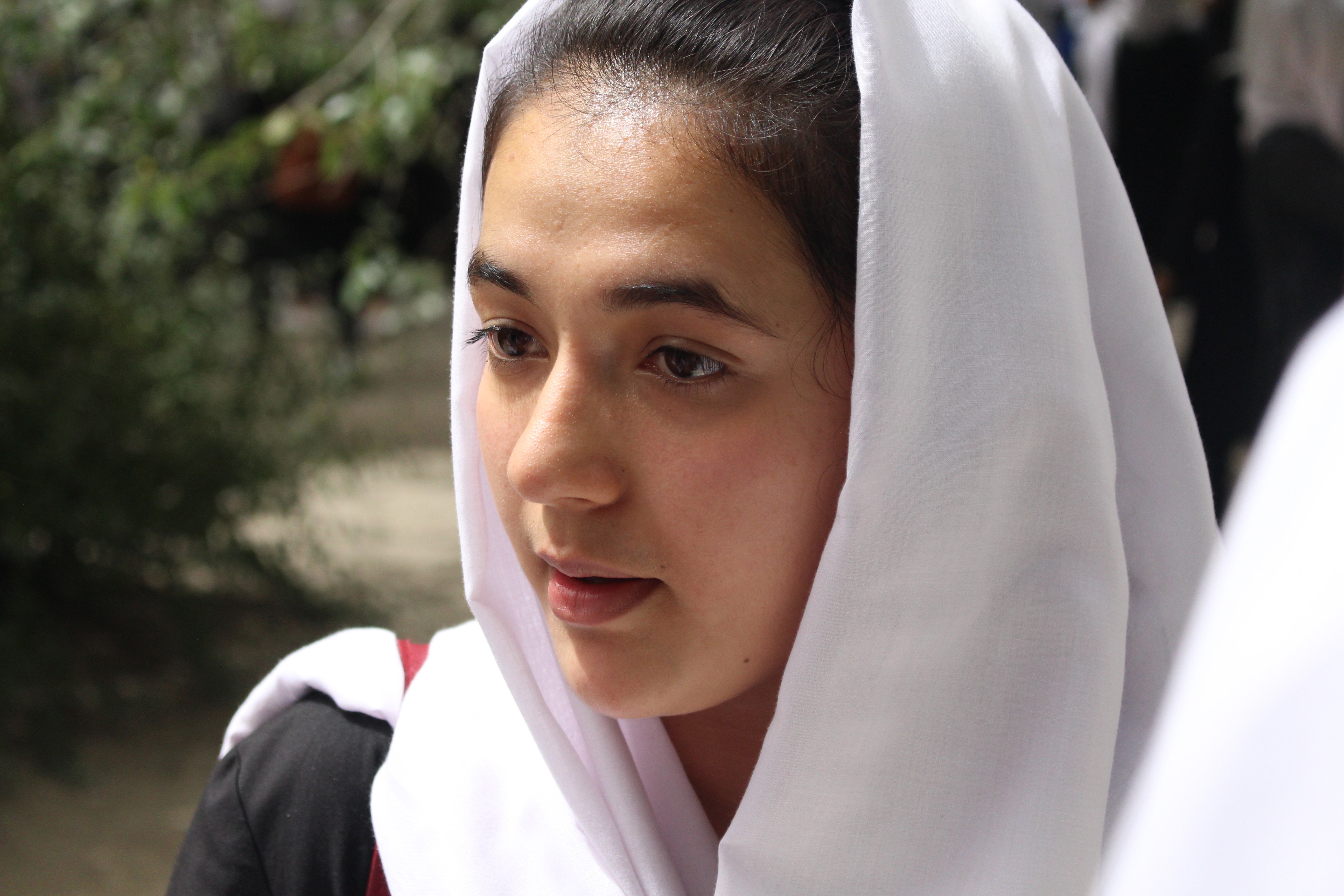 Safia Hussain, 18, speaks with her Best Friend Group at Zarghoona High School