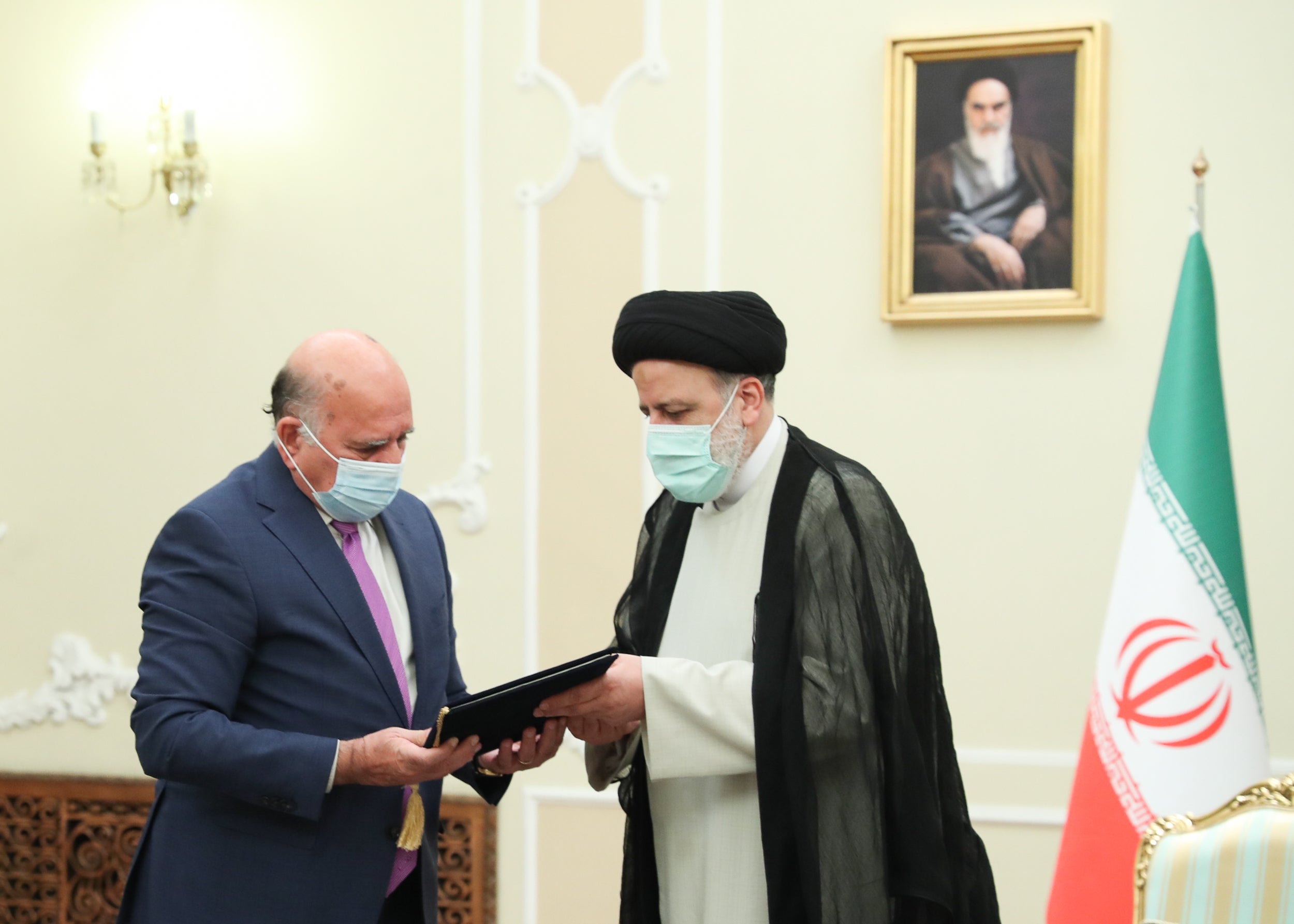 Minister of Foreign Affairs of Iraq Fuad Hussein (L) meets President of Iran Ebrahim Raisi in Tehran