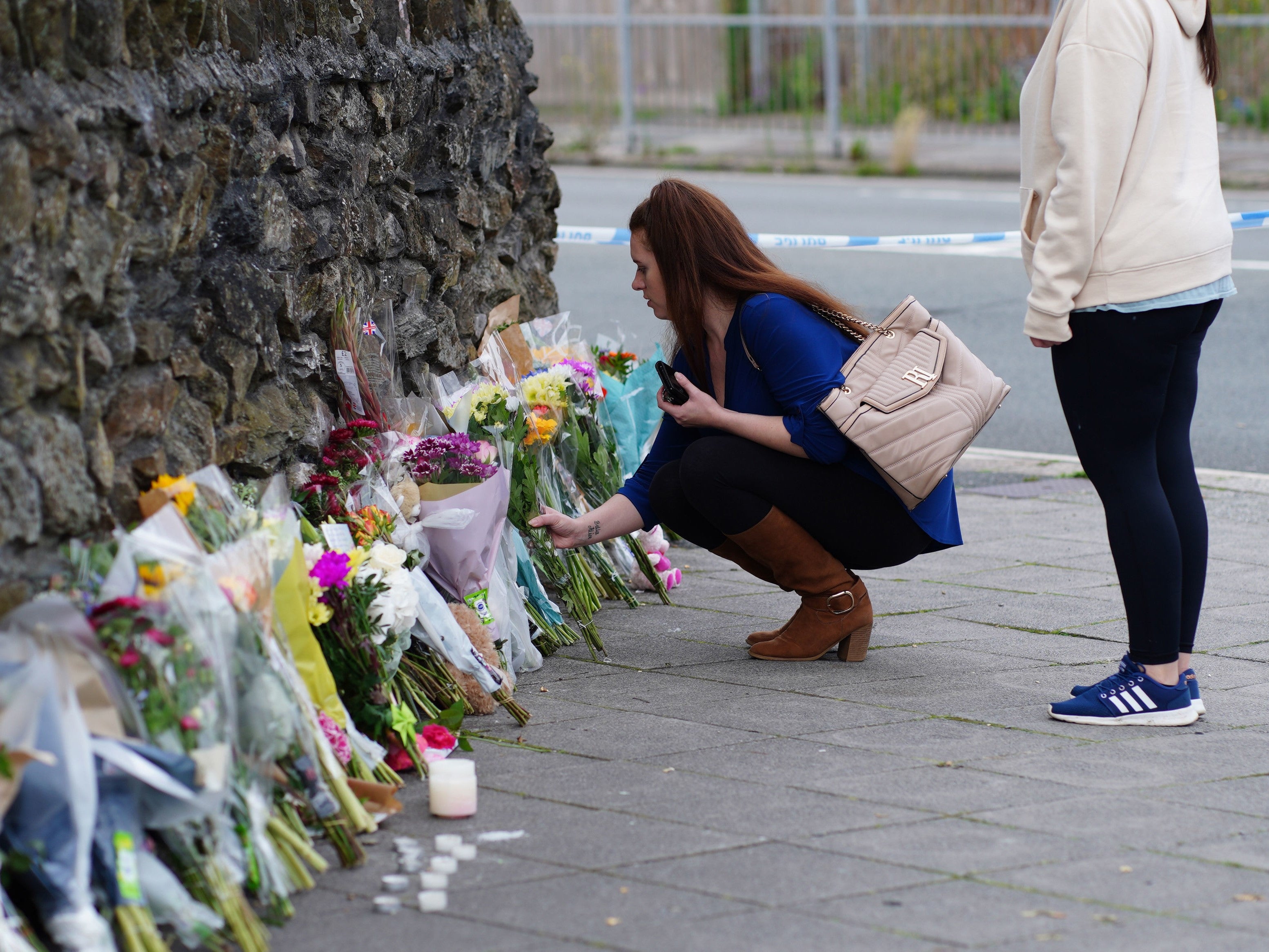 People leave flowers in the Keyham area of Plymouth following Thursday’s shooting