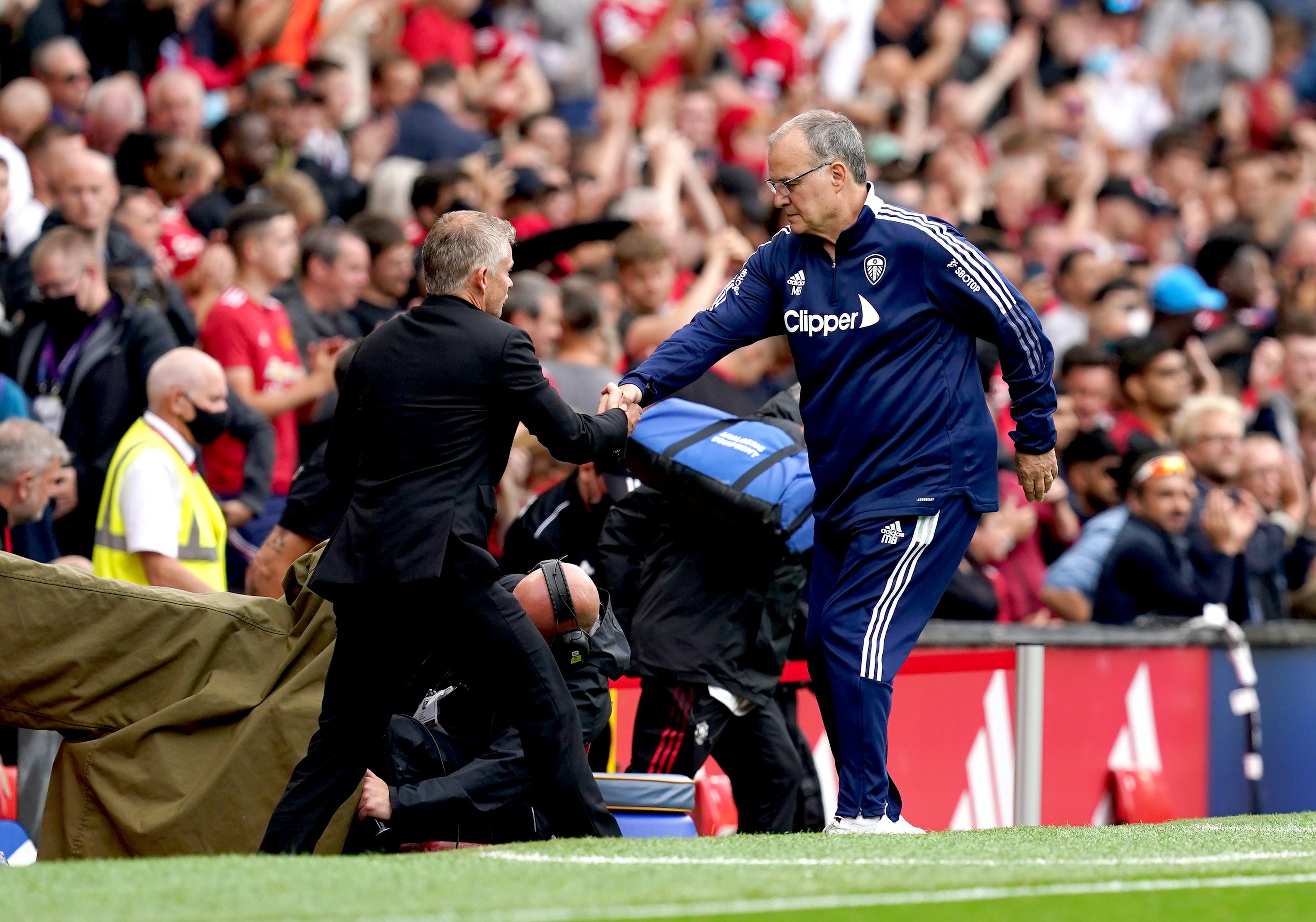 Leeds manager Marcelo Bielsa (right) shakes hands with Manchester United manager Ole Gunnar Solskjaer (Martin Rickett/PA)