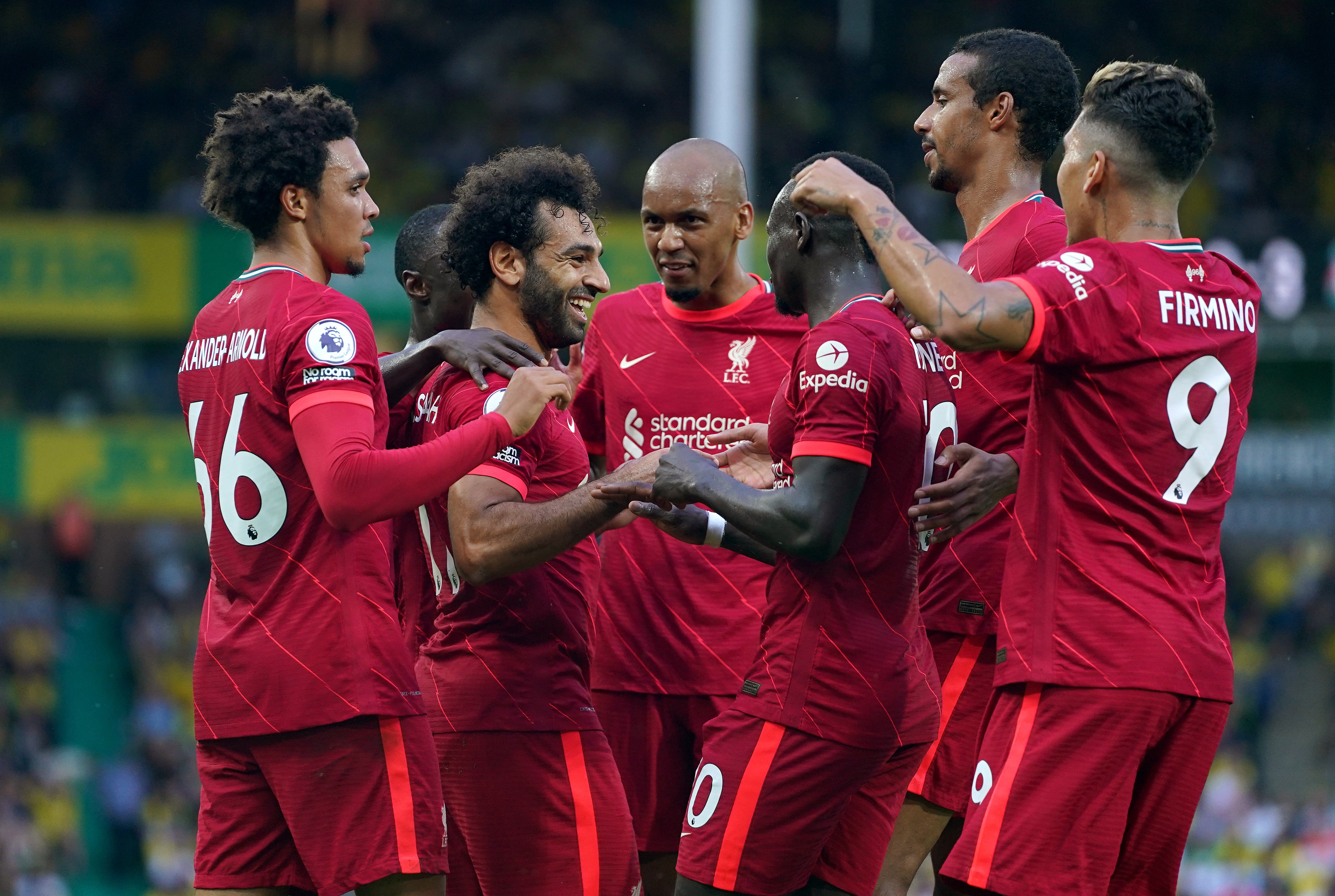 Mohamed Salah (third left) celebrates with his team-mates after scoring the third goal (Joe Giddens/PA)