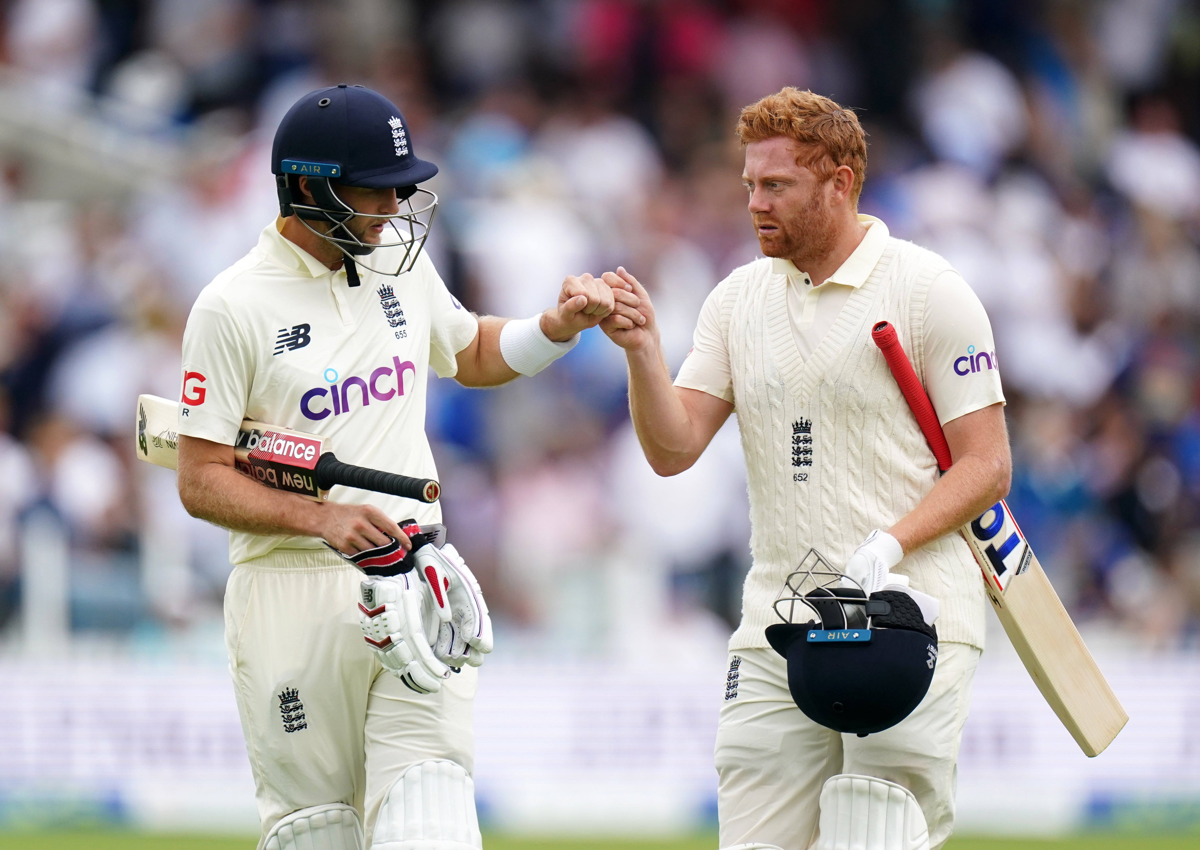 England’s Joe Root, left, and Jonny Bairstow walk off for lunch (Zac Goodwin/PA)