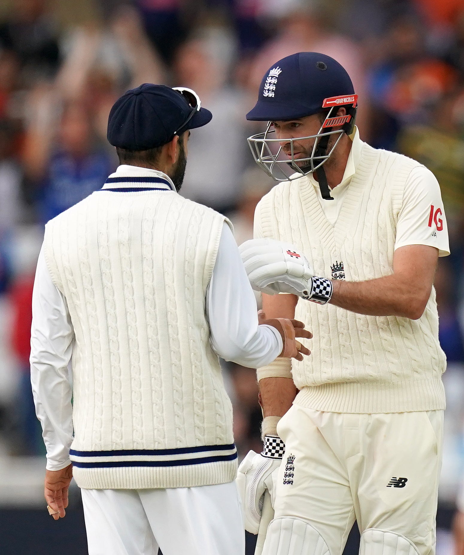 England’s Jimmy Anderson, right, exchanges words with India’s Virat Kohli (Tim Goode/PA)