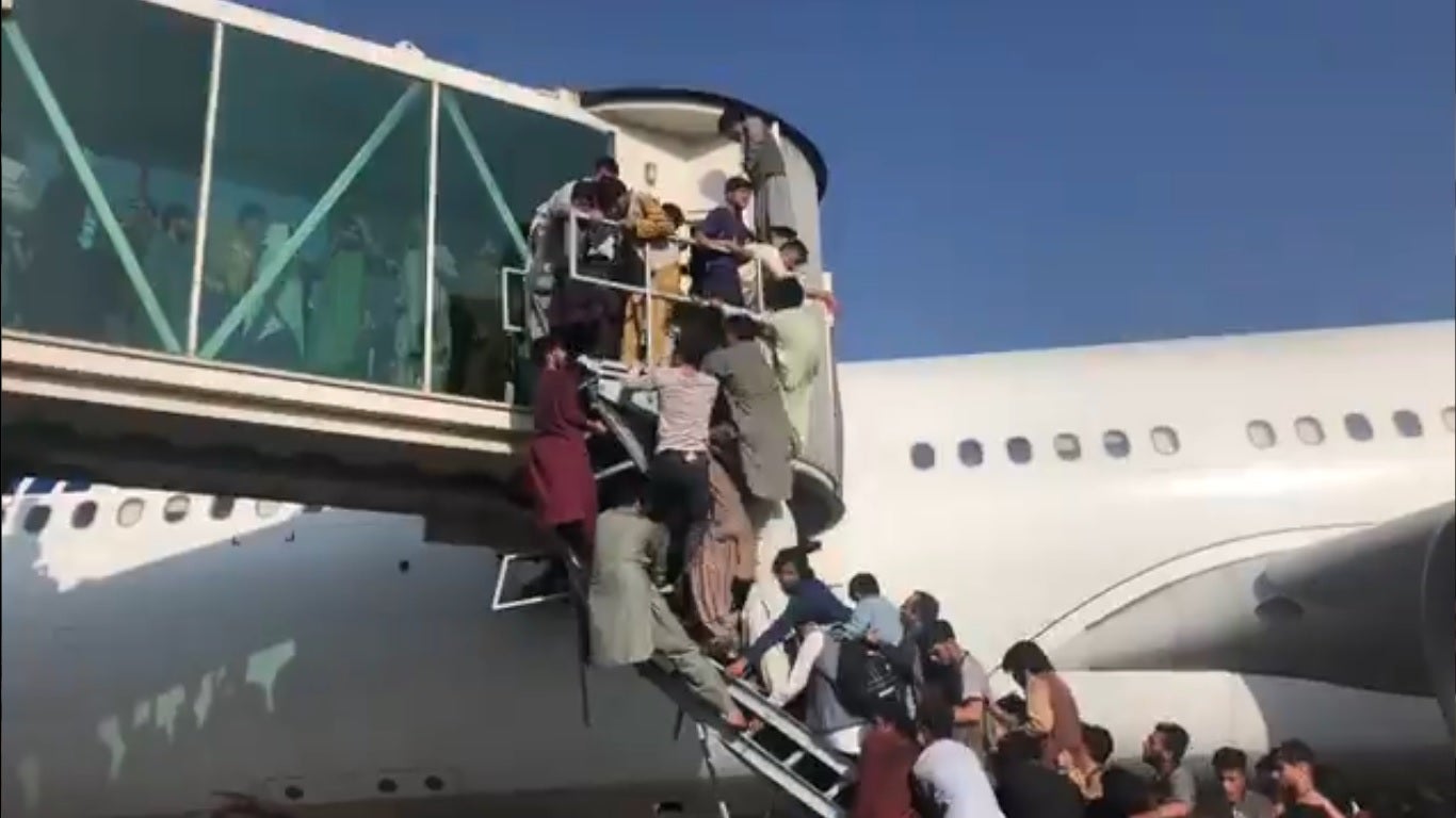 Chaotic scenes at Kabul airport showed people thronging on to gangplank, runways and taxiway of the airport to escape Afghanistan