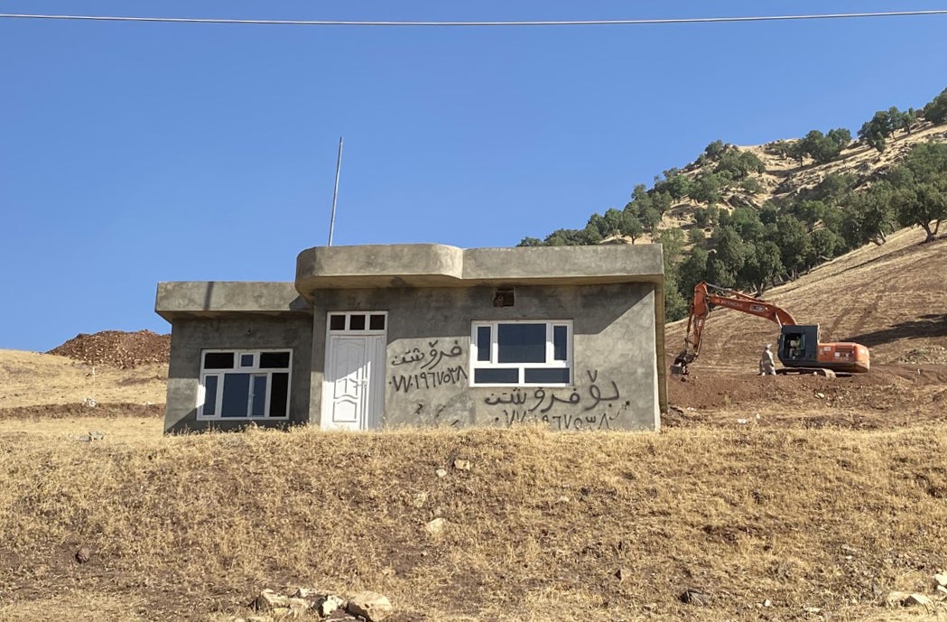 A building marked ‘For sale’ just above the village of Wlyawa, on the edge of a vast minefield