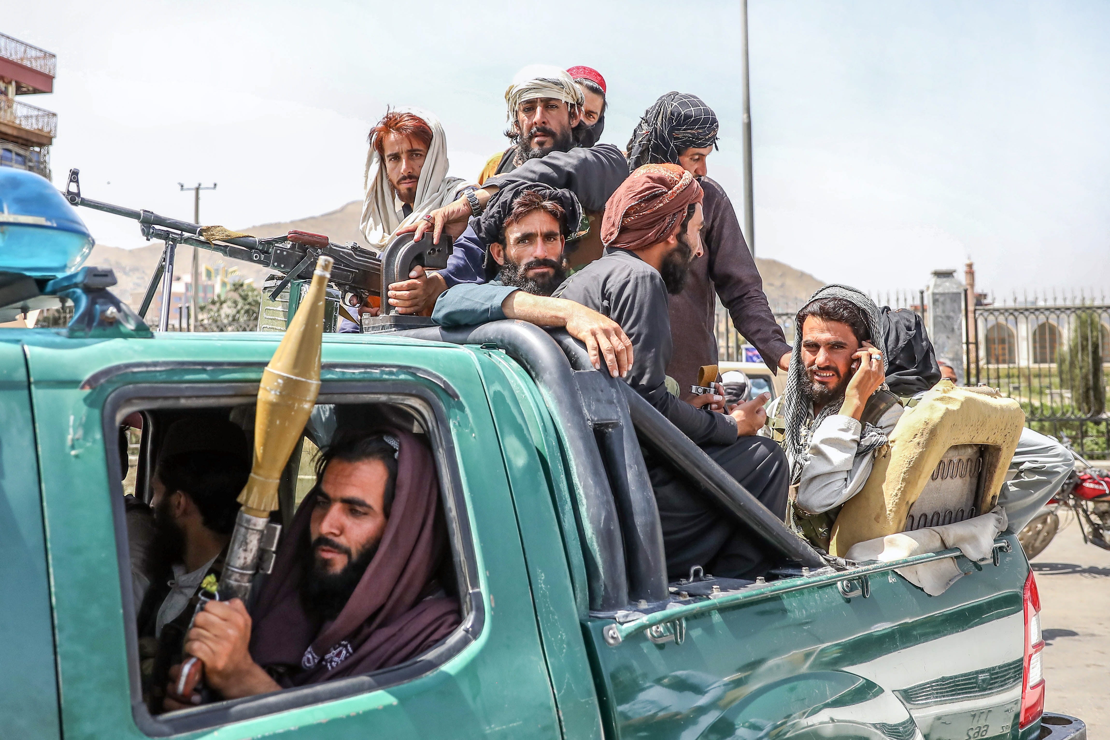 Taliban fighters on the back of a vehicle in Kabul, Afghanistan on Monday