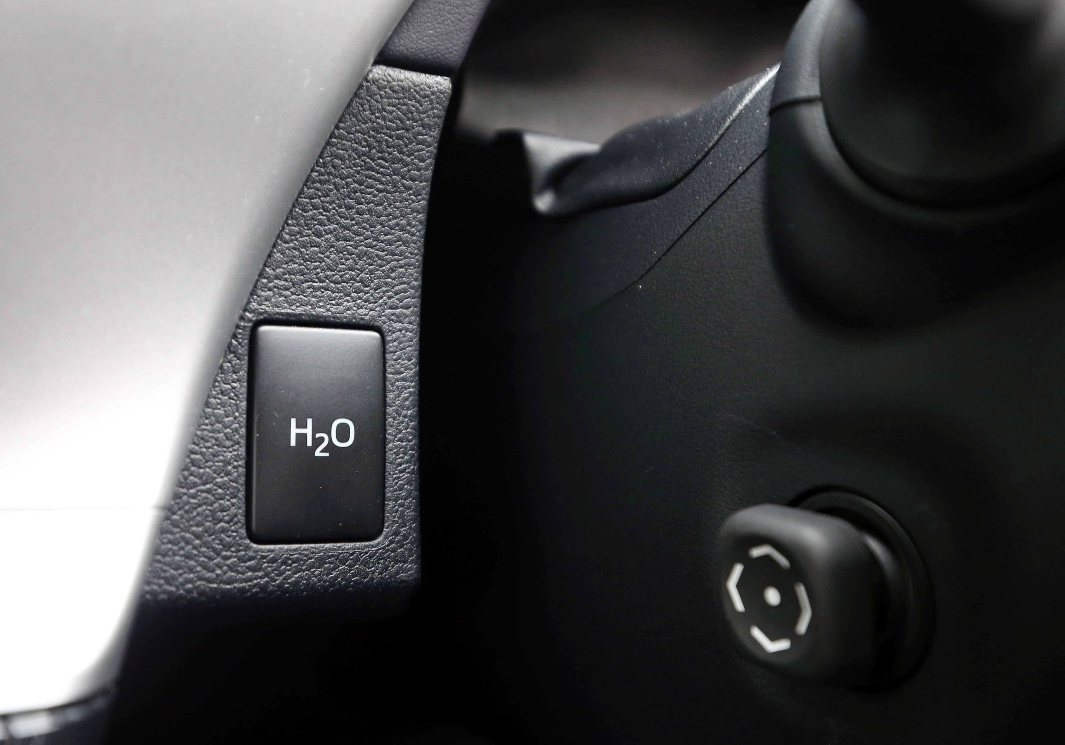 The button to disperse water from the exhaust pipe of the first mass production dedicated hydrogen fuel cell vehicle (Steve Parsons/PA)